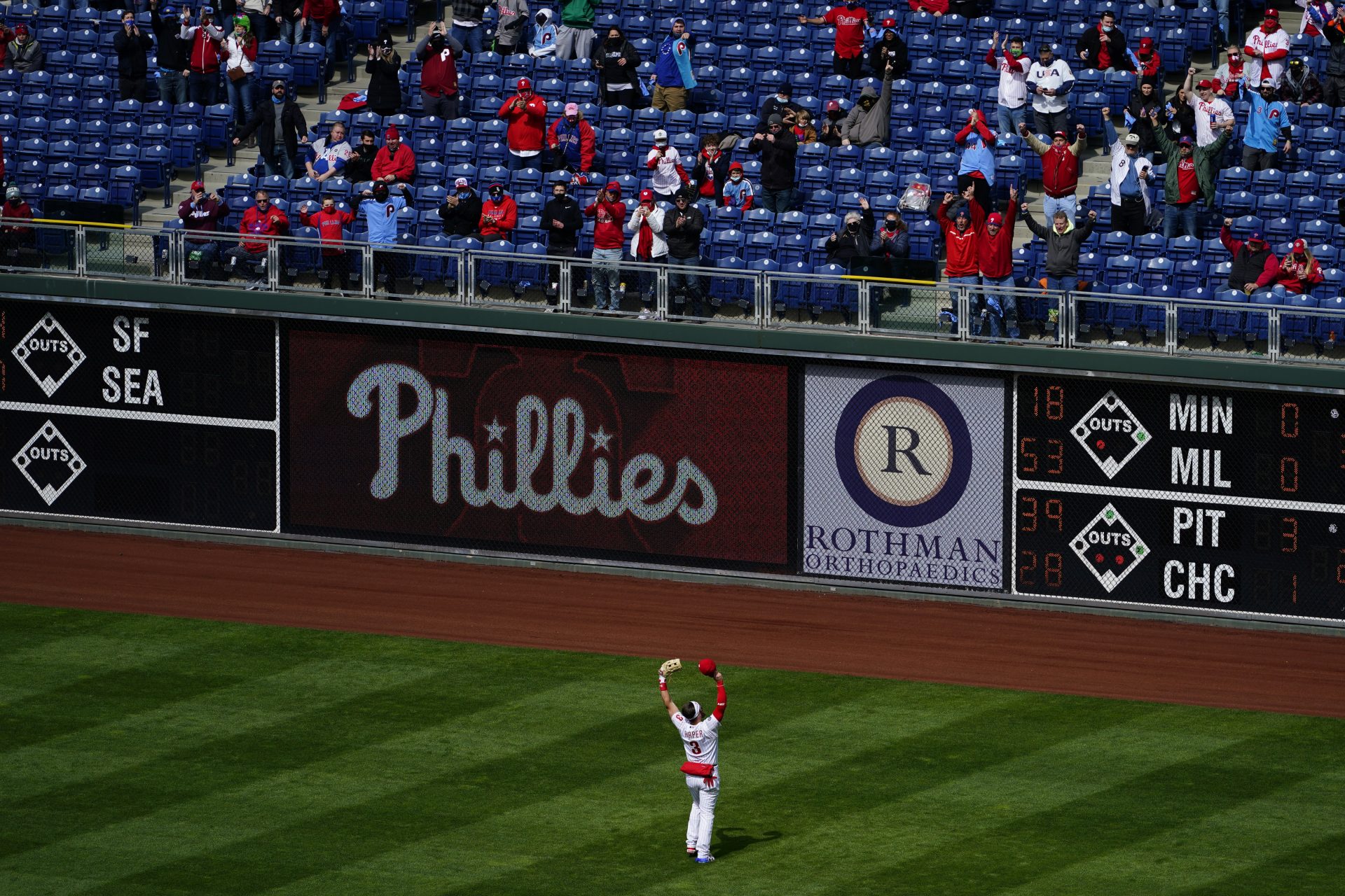 Philadelphia Phillies' Bryce Harper gestures to the fans during before an opening day baseball game against the Atlanta Braves, Thursday, April 1, 2021, in Philadelphia.