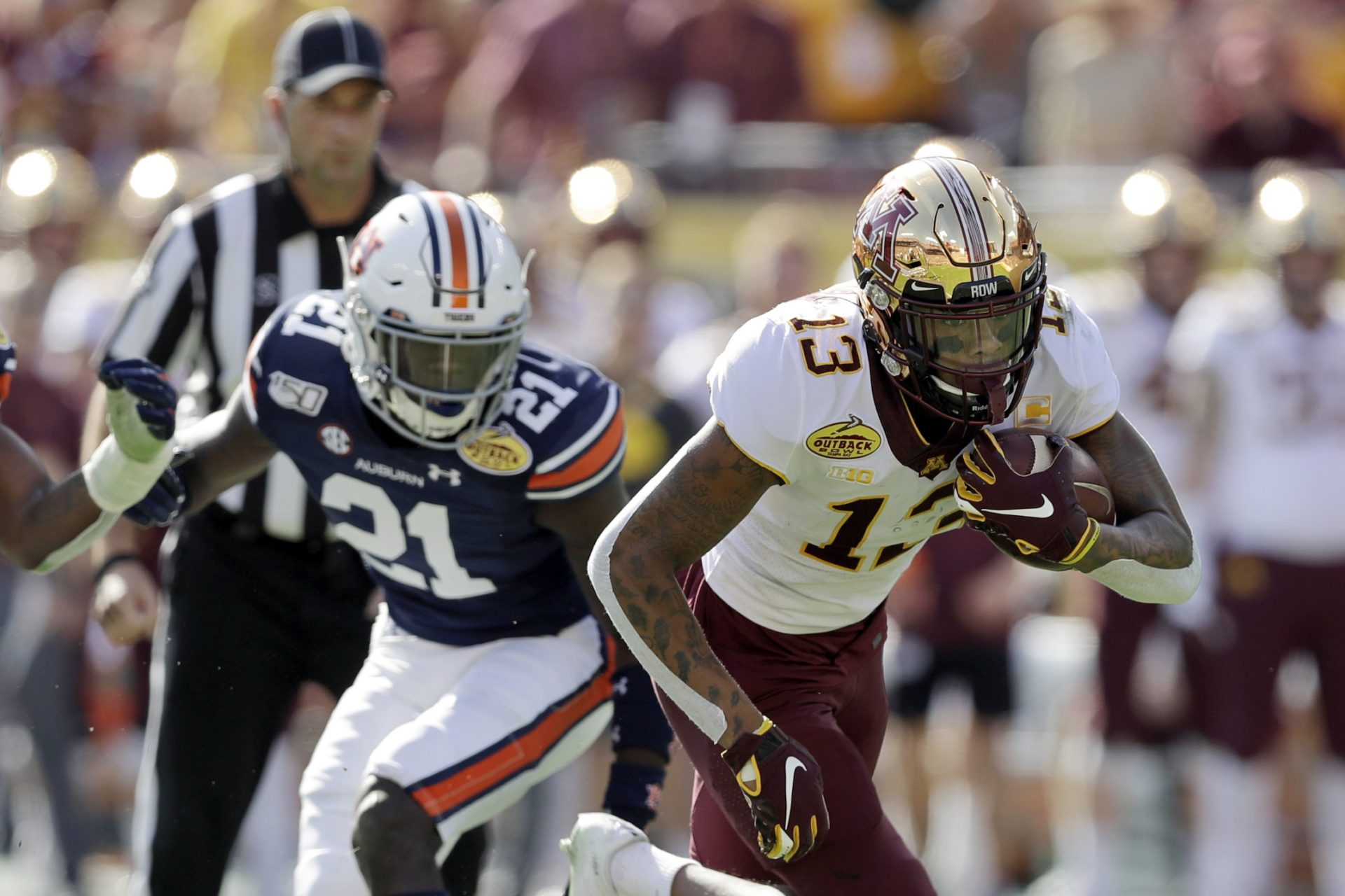 In this Jan. 1, 2020, file photo, Minnesota wide receiver Rashod Bateman (13) turns upfield against Auburn during the first half of the Outback Bowl NCAA college football gam in Tampa, Fla.