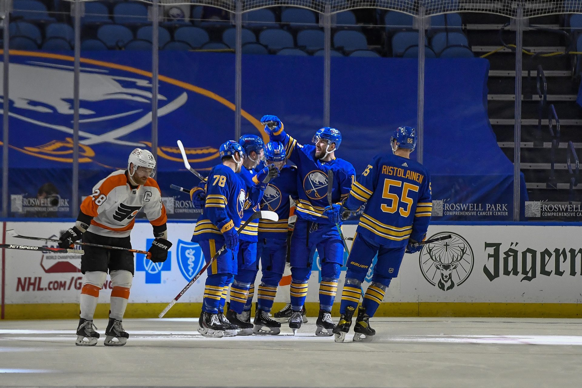 Buffalo Sabres celebrate a goal by center Curtis Lazar (27) during the first period of an NHL hockey game against the Philadelphia Flyers in Buffalo, N.Y., Wednesday, March 31, 2021.