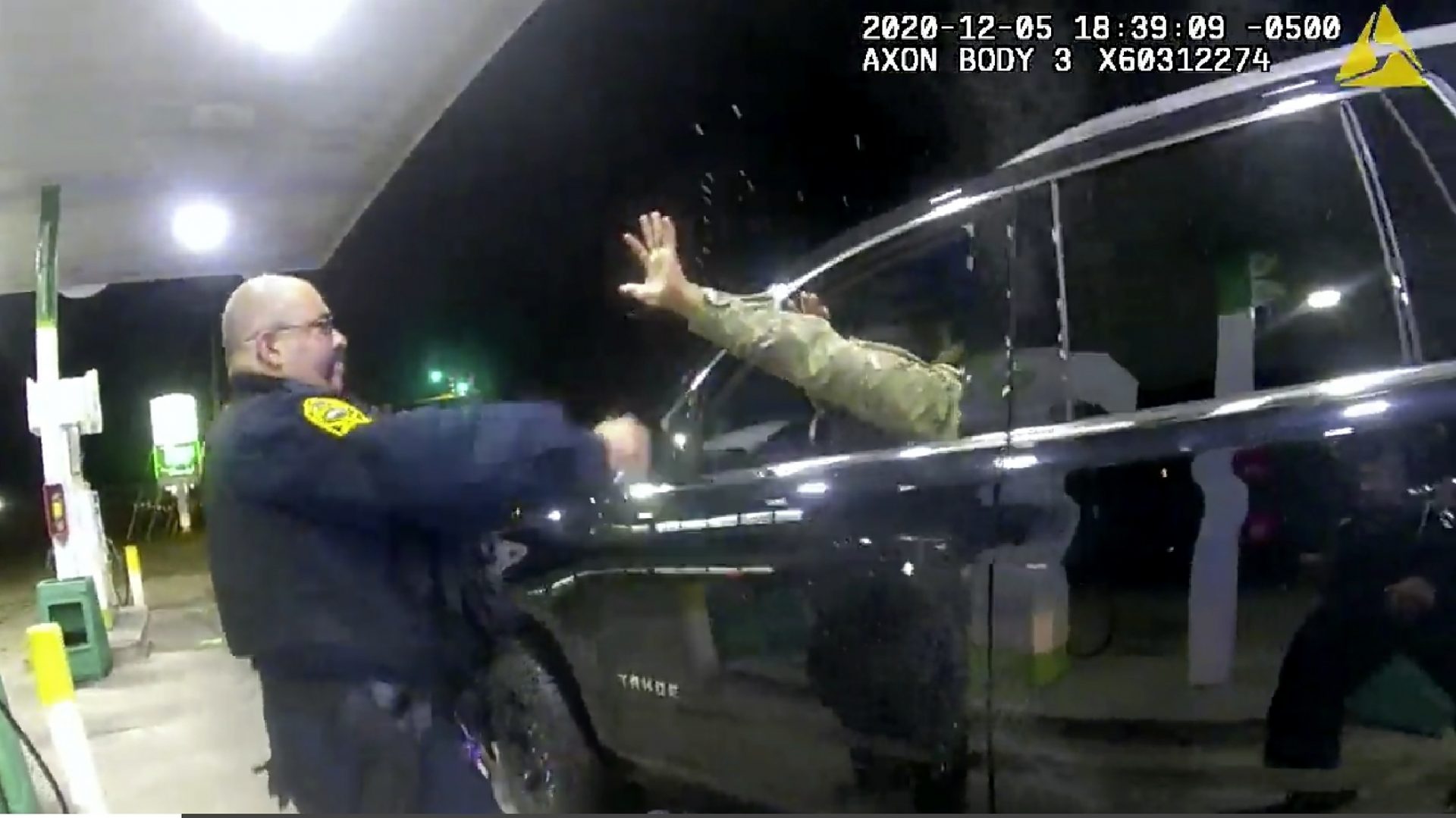 In this image made from Windsor, (Va.) Police video, A police officer uses a spray agent on Caron Nazario on Dec. 20, 2020, in Windsor, Va.