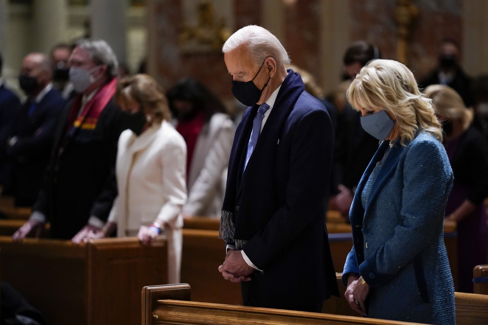 FILE PHOTO: In this Wednesday, Jan. 20, 2021 file photo, President-elect Joe Biden and his wife, Jill Biden, attend Mass at the Cathedral of St. Matthew the Apostle during Inauguration Day ceremonies in Washington. When U.S. Catholic bishops hold their next national meeting in June 2021, they’ll be deciding whether to send a tougher-than-ever message to President Joe Biden and other Catholic politicians: Don’t partake of Communion if you persist in public advocacy of abortion rights.