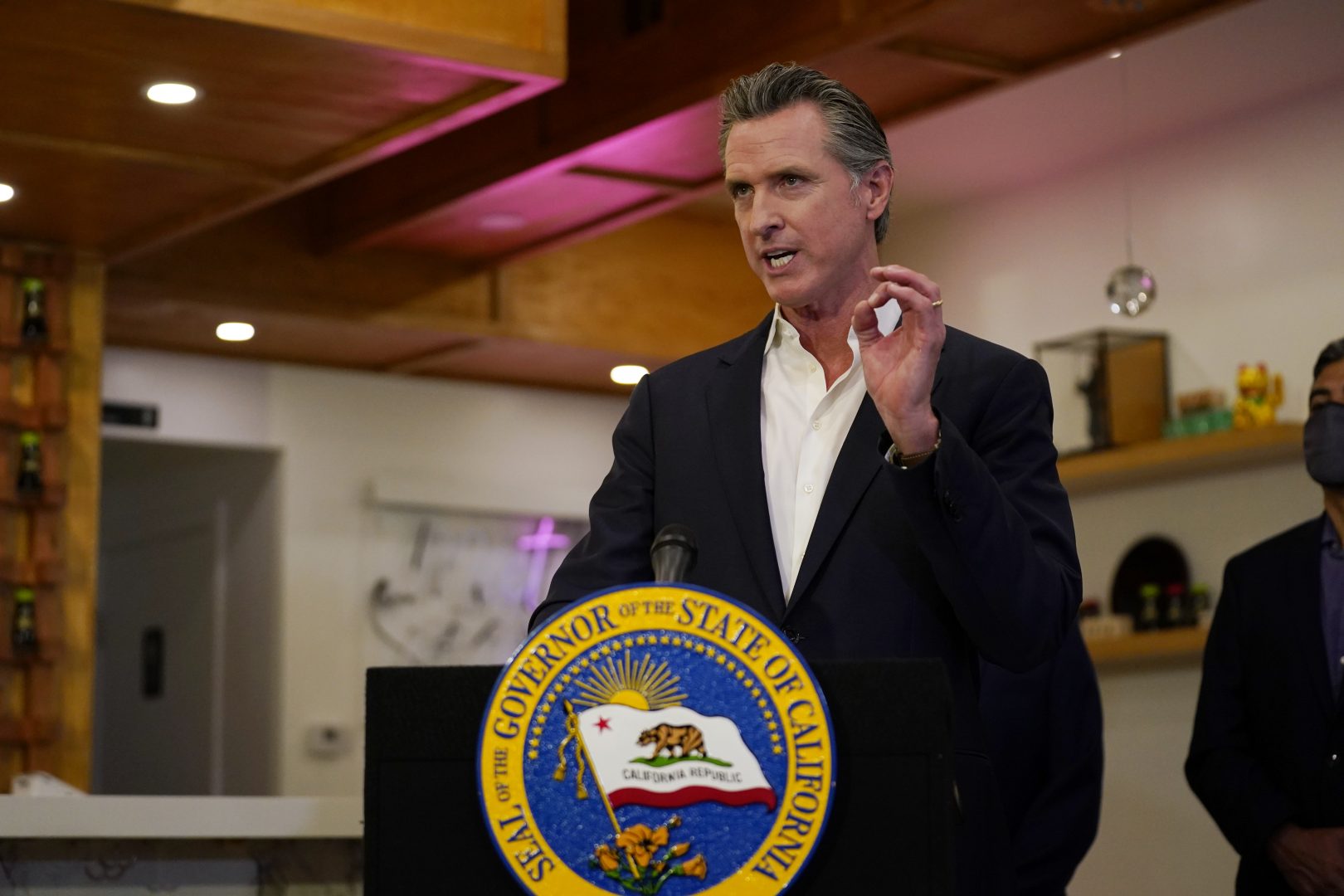 FILE PHOTO: California Gov. Gavin Newsom speaks at Hanzo Sushi Thursday, April 29, 2021, in San Fernando, Calif. Businesses could be spared billions of dollars of higher taxes in coming years as a result of federal coronavirus relief funds flowing to the states. Newsom announced a budget plan this spring that would use $1.1 billion from the latest federal COVID-19 relief law to bolster a depleted unemployment compensation accounts.