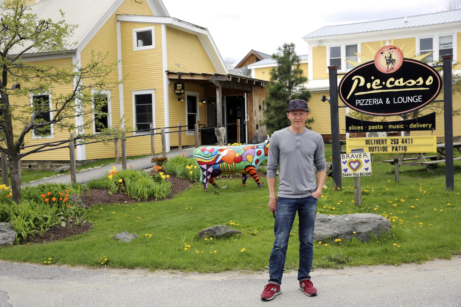 Eduardo Rovetto poses outside his restaurant Piecasso Pizzeria & Lounge in Stowe, Vt., on Saturday, May 8, 2021. Rovetto says he would like to hire between 15 and 20 workers before what is expected to be a busy summer tourist season, but he’s not getting enough interest.