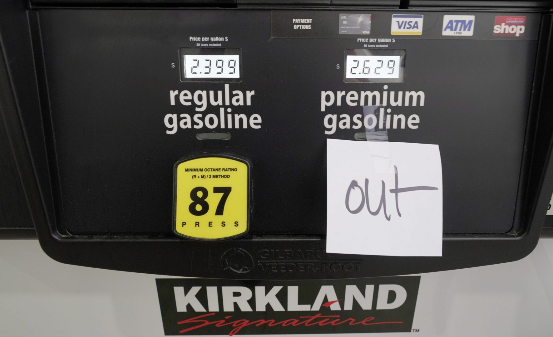 A note posted at a gas pump indicates the pump is out of premium gasoline at a Costco Warehouse fuel station, Tuesday, May 11, 2021, in Ridgeland, Miss.