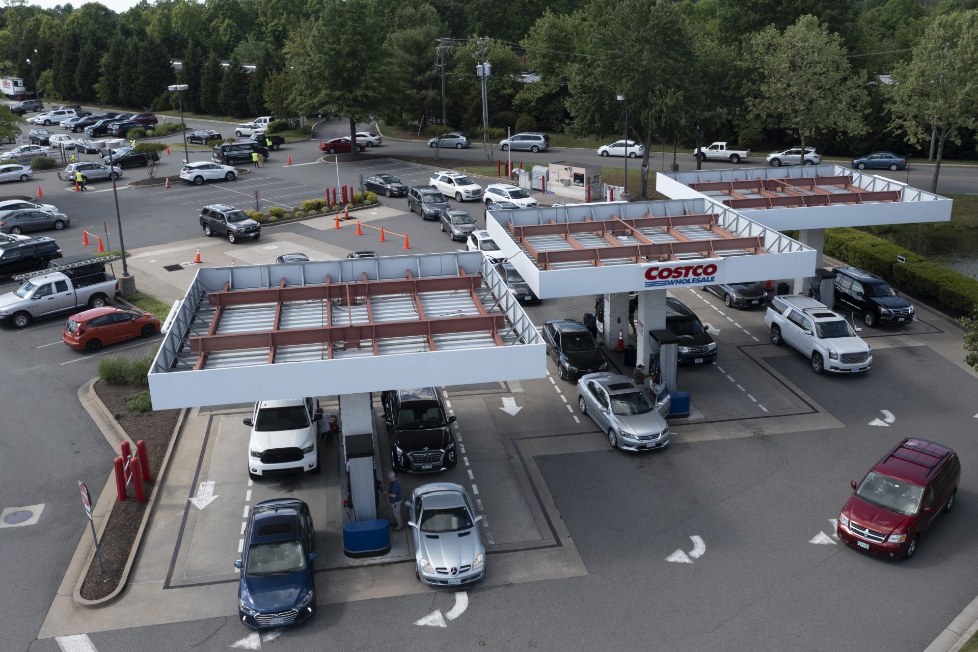 Gas customers swarm a COSTCO gas station amid fears of a gas shortage in Richmond, Va., Tuesday, May 11, 2021. The line at the facility extended around the entire building.