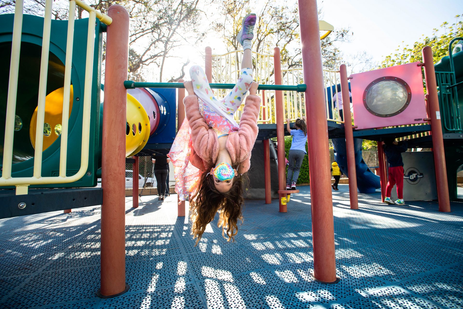 Robin Heilweil, 6, wears a mask while swinging around with her kindergarten class at Kenter Canyon School in Los Angeles earlier this month.