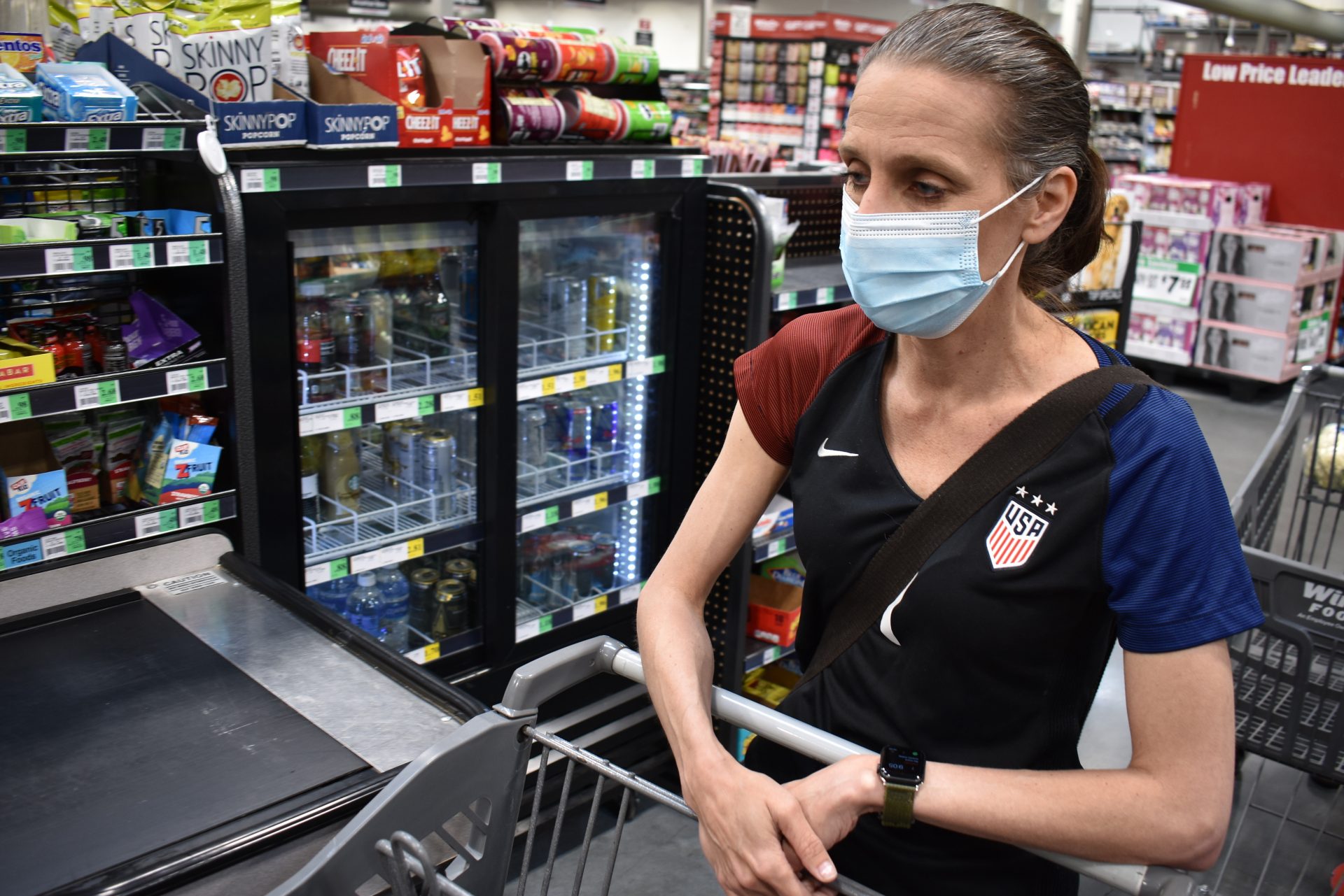 Crystal Dvorak shops at WinCo Foods, Saturday, May, 7, 2021, in Billings, Mont. Dvorak recently lost her job as an audiologist. The day Montana Gov. Greg Gianforte announced the $300 benefit would end June 27 was Dvorak’s second day of unemployment.