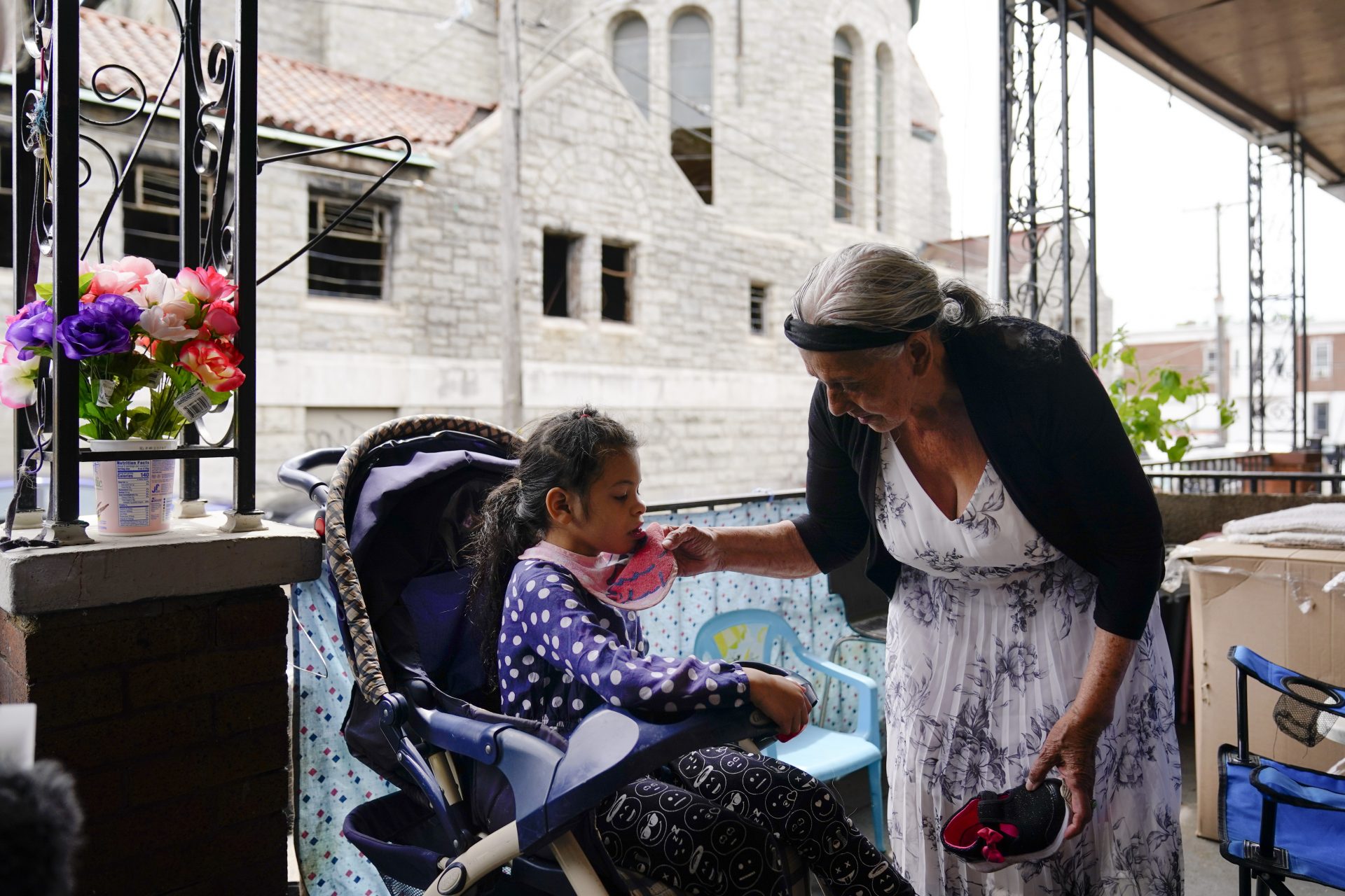 Amanda Brebe, 75, tends to her granddaughter Zuniga Gonzales, 7, in the Kensington section of Philadelphia, Sunday, May 16, 2021.