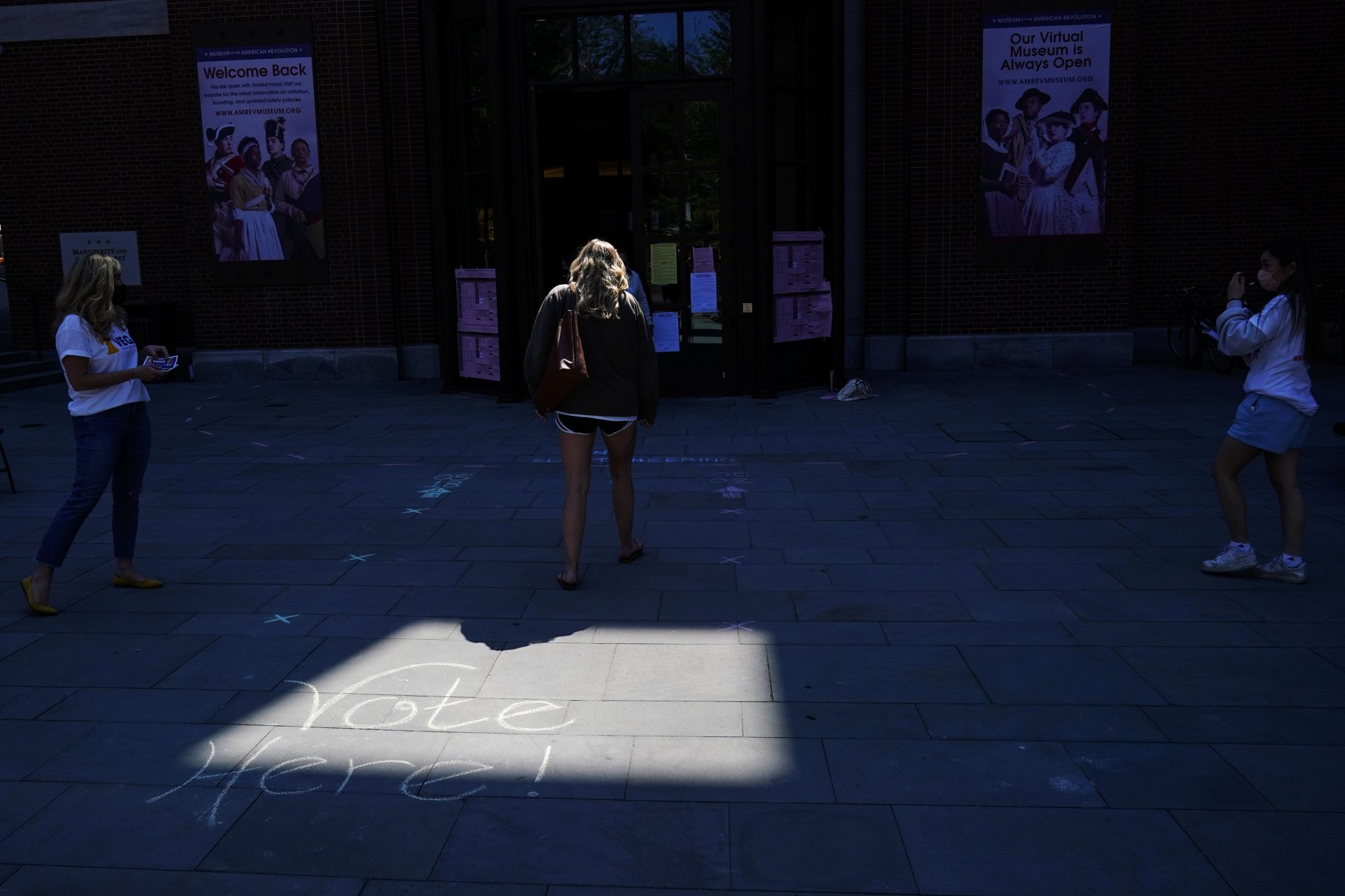 A voter walks to a polling place in the Museum of the American Revolution in Philadelphia, Tuesday, May 18, 2021.