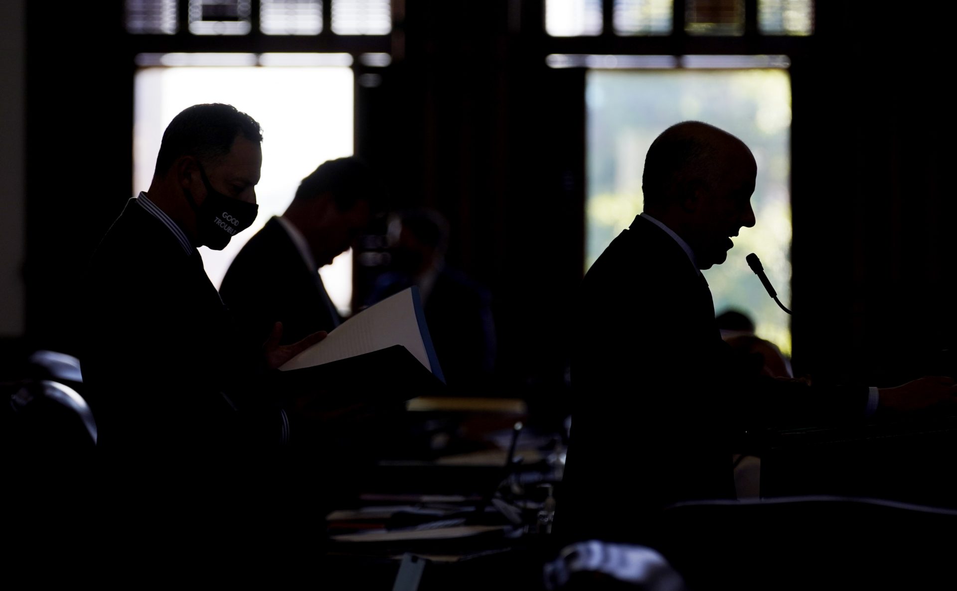 Rep. Chris Turner, D-Arlington, right, and Rep. Rafael Anchia, D-Dallas, left, line up to speak against HB 6, an election bill, in the House Chamber at the Texas Capitol in Austin, Texas, Thursday, May 6, 2021.