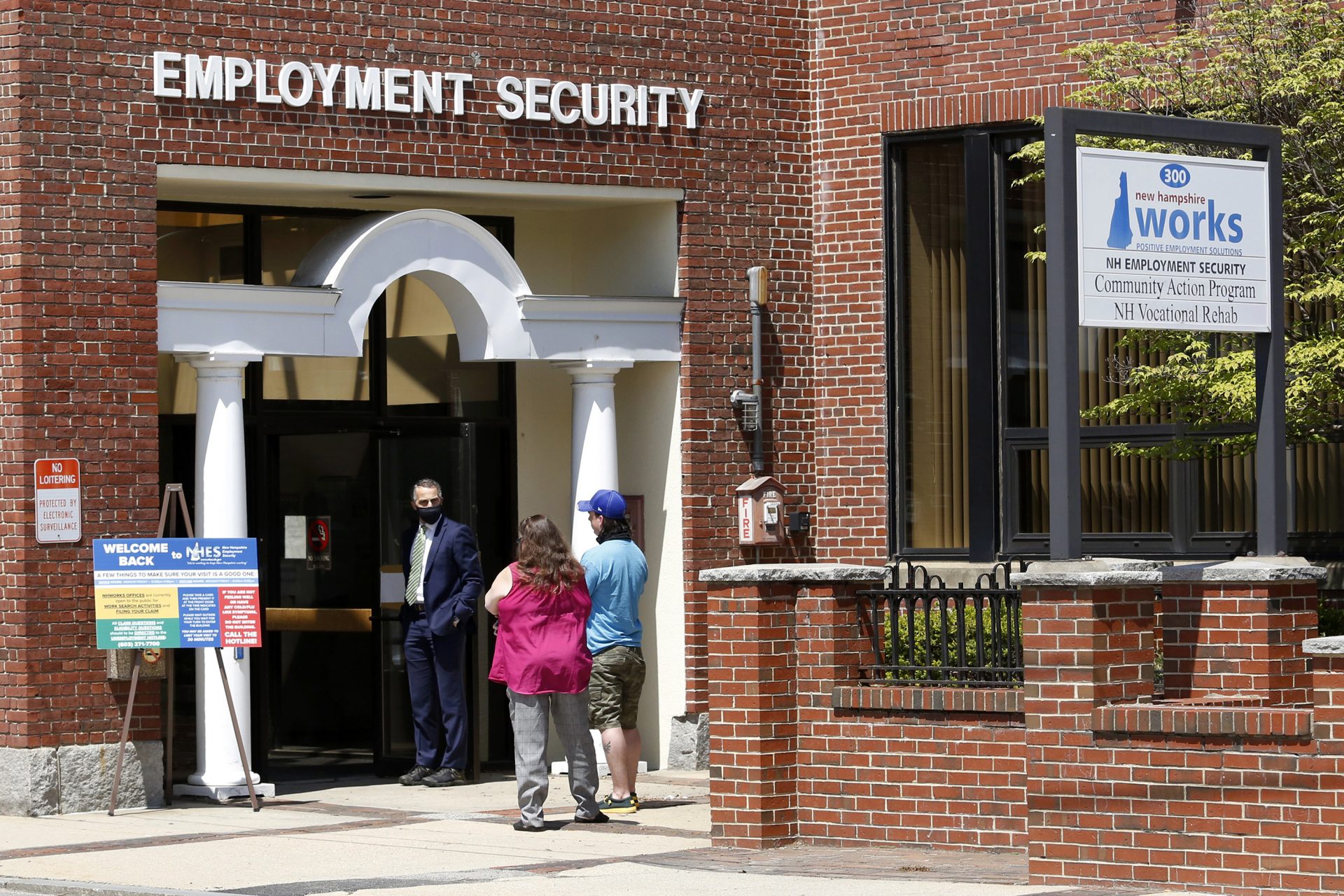 Job seekers line up outside the New Hampshire Works employment security job center, Monday, May 10, 2021, in Manchester, N.H.