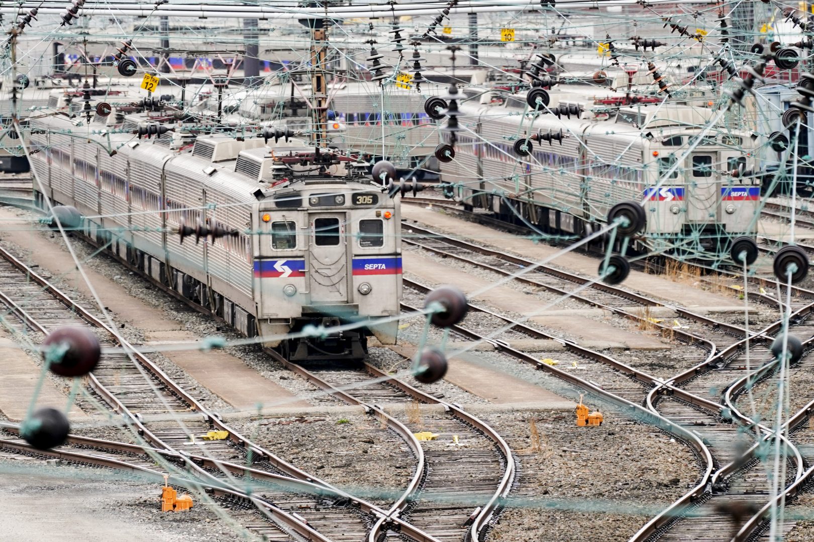 Southeastern Pennsylvania Transportation Authority trains are parked near 30th Street Station in Philadelphia, Wednesday, March 31, 2021.