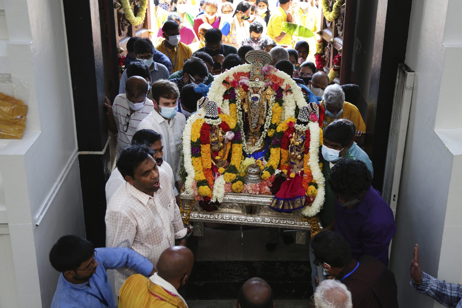 Sri Venkateswara Temple devotees and volunteers carry a deity back into the temple during Maha Kumbhabhishekam, a five-day Hindu rededication ceremony in Penn Hills, Pa., Sunday, June 27, 2021. Built in the 1970s, the Sri Venkateswara Temple is the oldest major Hindu temple in the country. Maha Kumbhabhishekams occur about every 12 years and involve ceremonies to reenergize the temple and its deities.