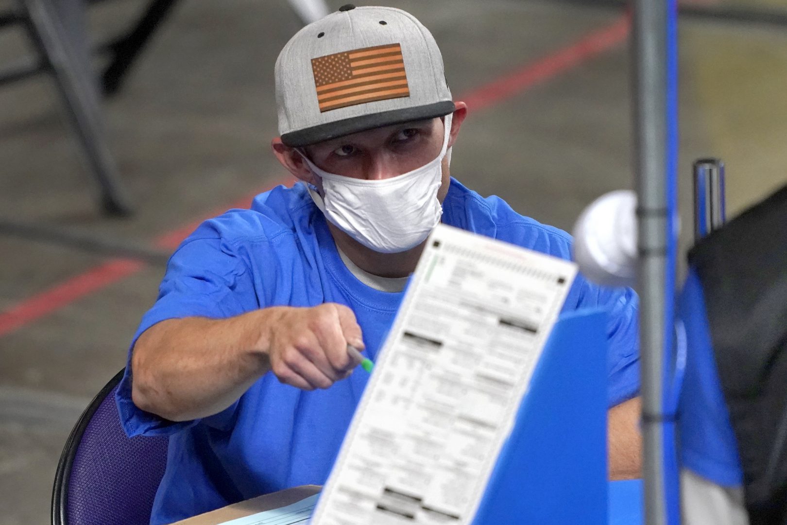 Maricopa County ballots cast in the 2020 general election are examined and recounted by contractors working for Florida-based company, Cyber Ninjas, Thursday, May 6, 2021 at Veterans Memorial Coliseum in Phoenix. The audit, ordered by the Arizona Senate, has the U.S. Department of Justice saying it is concerned about ballot security and potential voter intimidation arising from the unprecedented private recount of the 2020 presidential election results. 