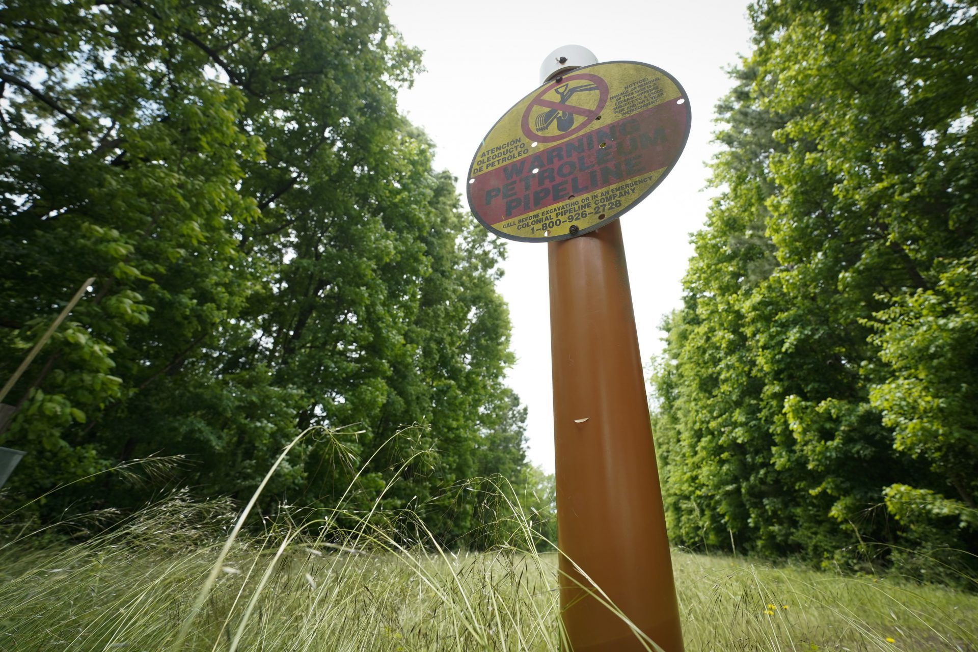 A sign marking the location of the Colonial Pipeline is posted on Tuesday, May 11, 2021, in Charlotte, N.C.