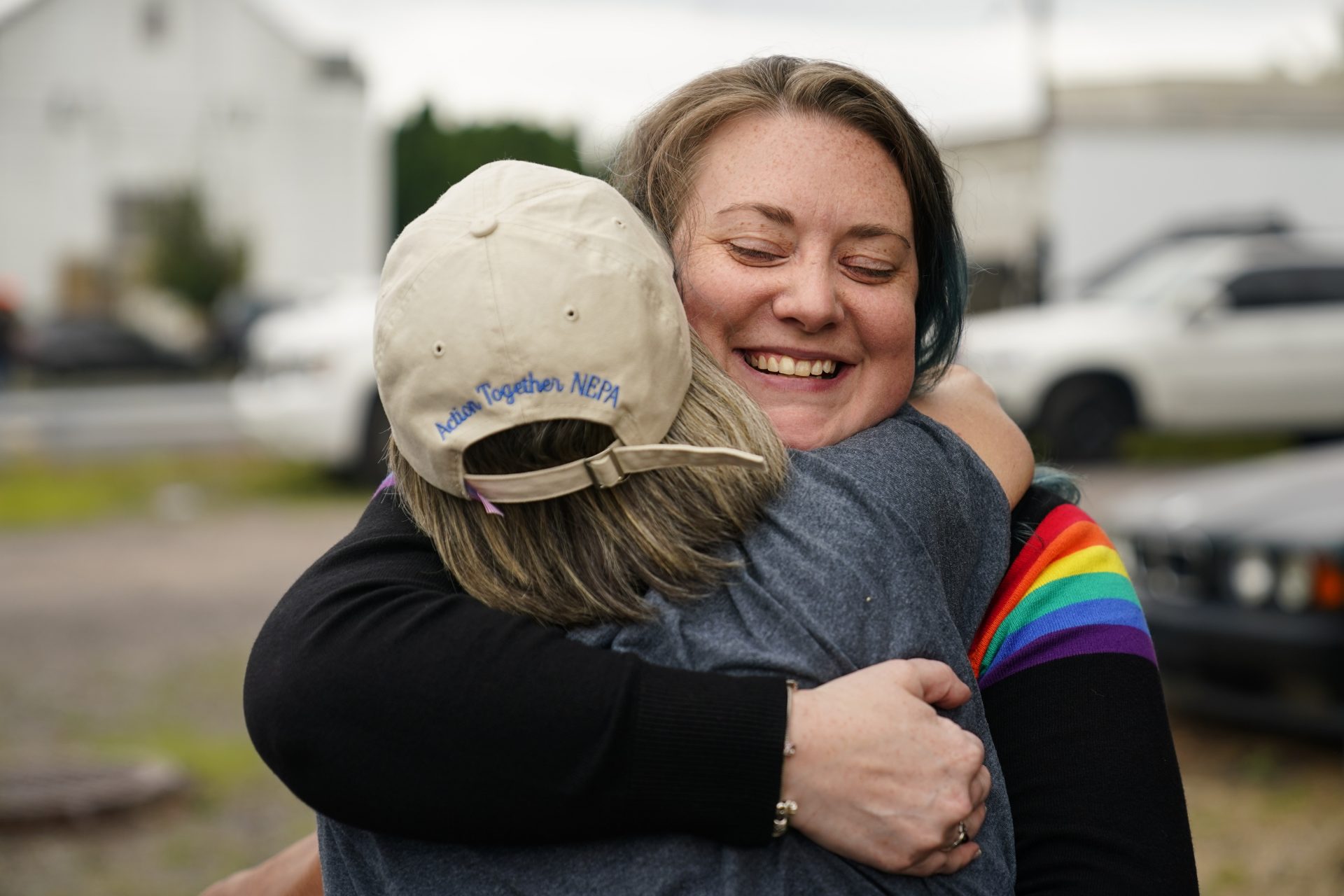 Alisha Hoffman-Mirilovich, right, and Claudia Glennan embrace at the Edwardsville Pierogi Festival in Edwardsville, Pa., Friday, June 11, 2021.