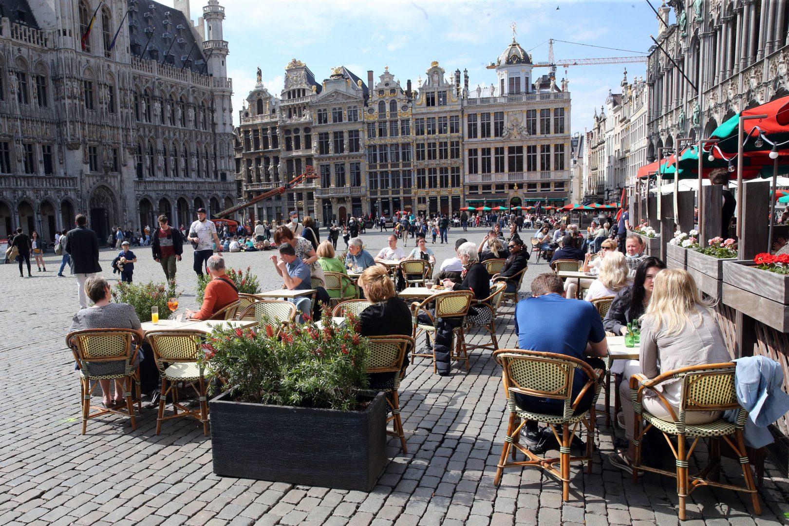 People sit at cafes' terraces at Brussels' Grand place on the second day of the reopening of the country's terraces in Brussels, on May 9, 2021, as part of the easing of the country's second lockdown aimed at curbing the spread of the Covid-19 pandemic, . (Photo by François WALSCHAERTS / AFP) (Photo by FRANCOIS WALSCHAERTS/AFP via Getty Images)