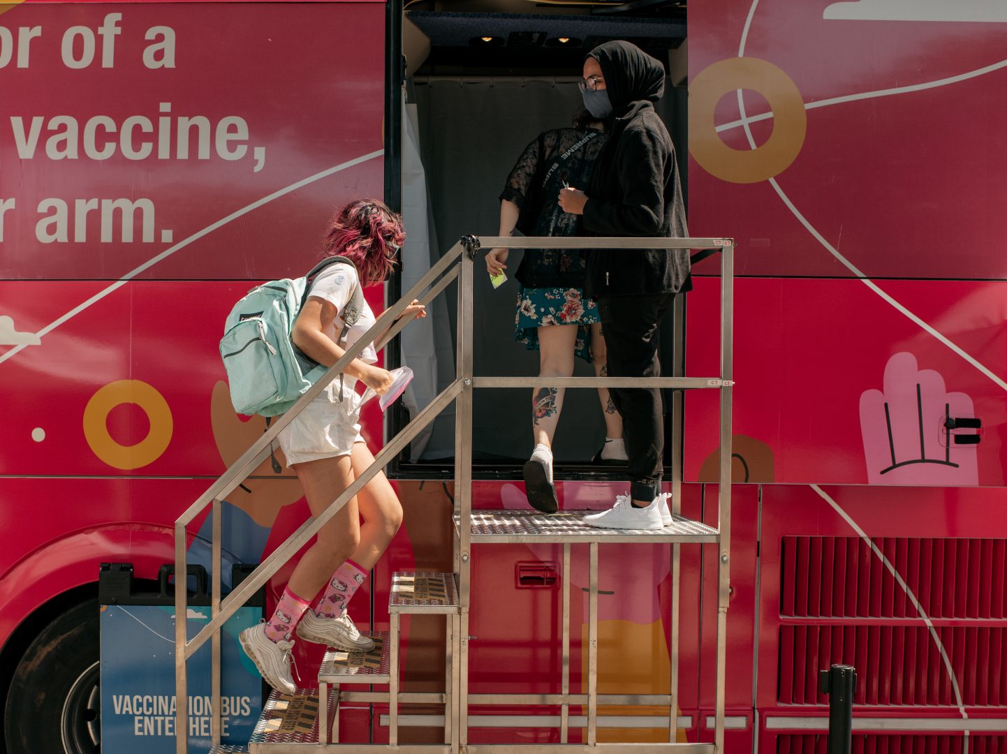 A teenager enters a pop-up COVID-19 vaccine site this month in the Jackson Heights neighborhood of Queens in New York City.