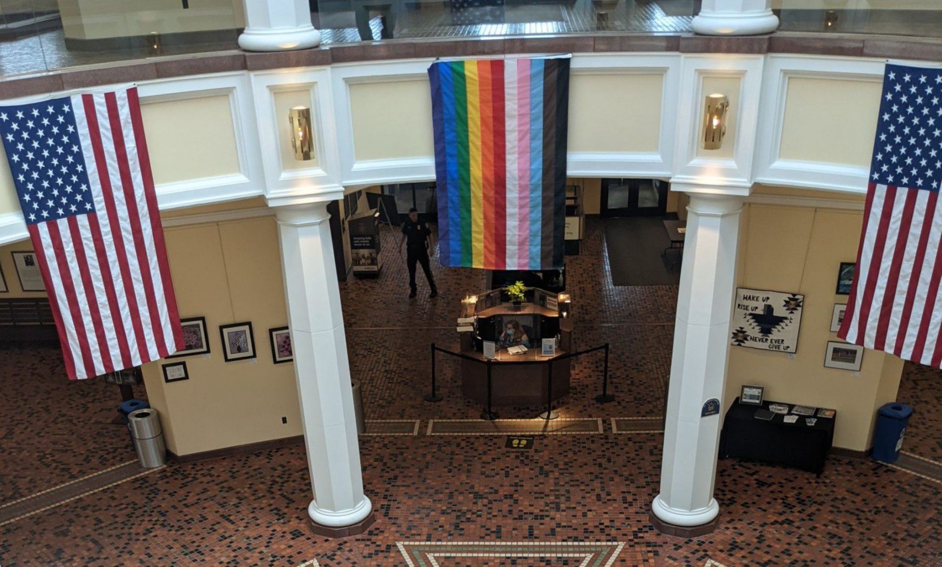 A Pride flag is currently hanging inside the Capitol’s East Wing Rotunda as part of a permitted display requested by the Commission on LGBTQ Affairs’ executive director.