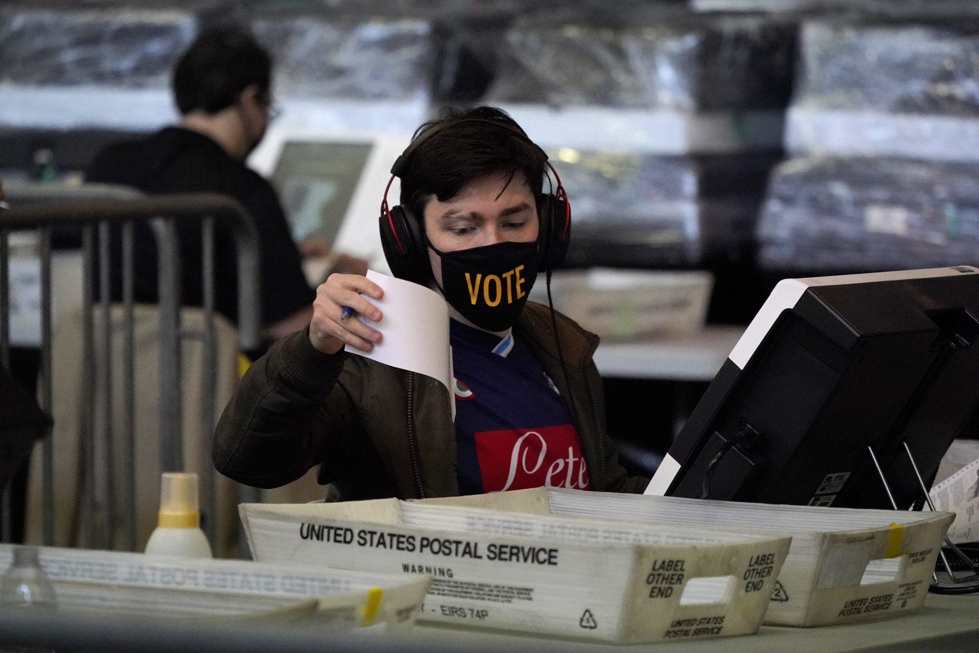 In this Nov. 6, 2020, file photo, ballots from the Nov. 3, 2020 general election are counted at the Allegheny County Election Division warehouse on the Northside of Pittsburgh.