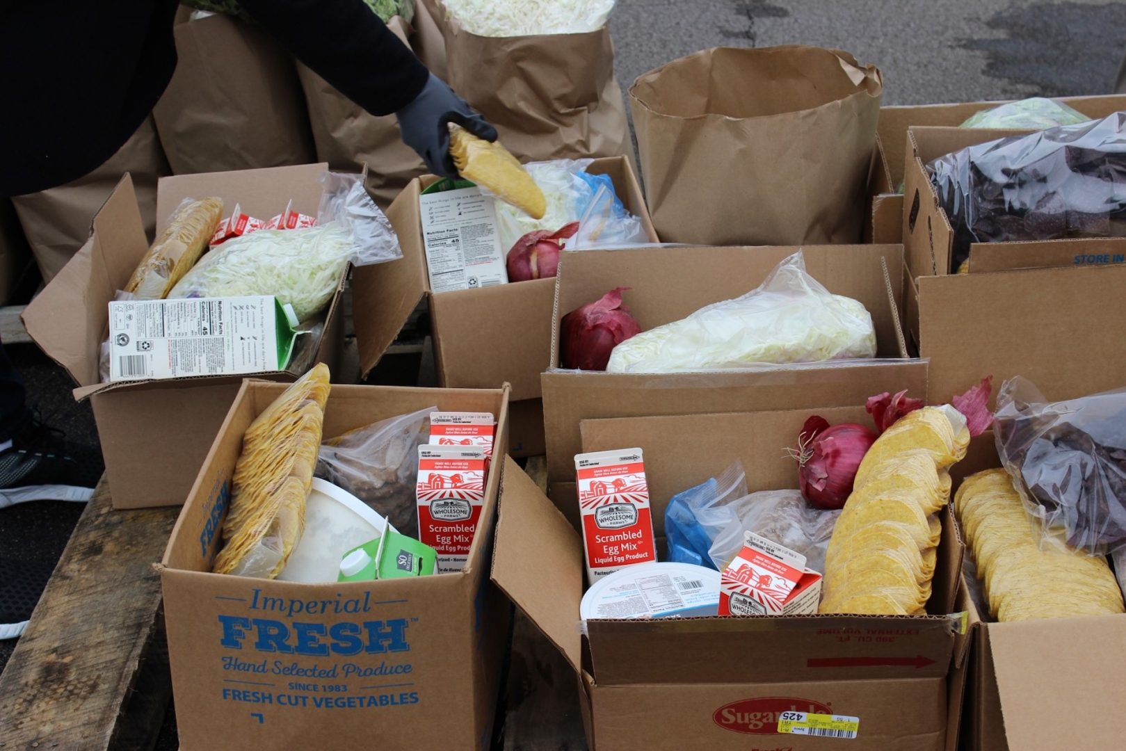 Food is prepared for delivery to Pittsburgh residents during a distribution event on the North Shore on April 24, 2020.