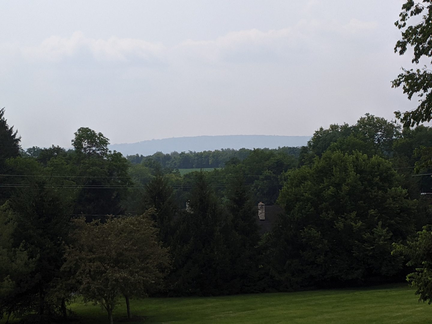 Haze from wildfires covers a mountain seen from Swatara Township, Dauphin County on Wednesday, July 21, 2021.