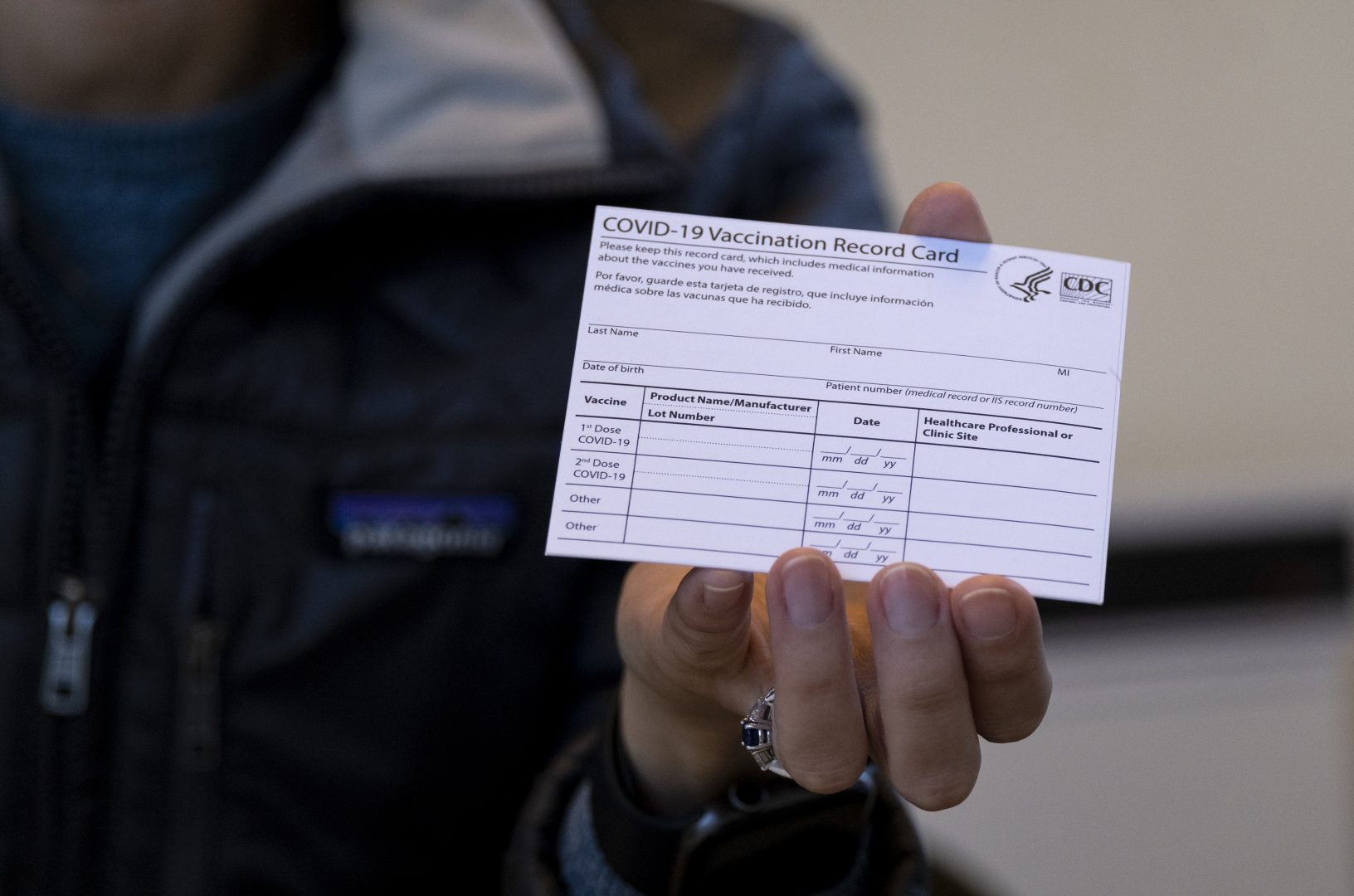 FILE PHOTO: In this Jan. 10, 2021 file photo, Sarah Gonzalez of New York, a Nurse Practitioner, displays a COVID-19 vaccine card at a New York Health and Hospitals vaccine clinic in the Brooklyn borough of New York. 