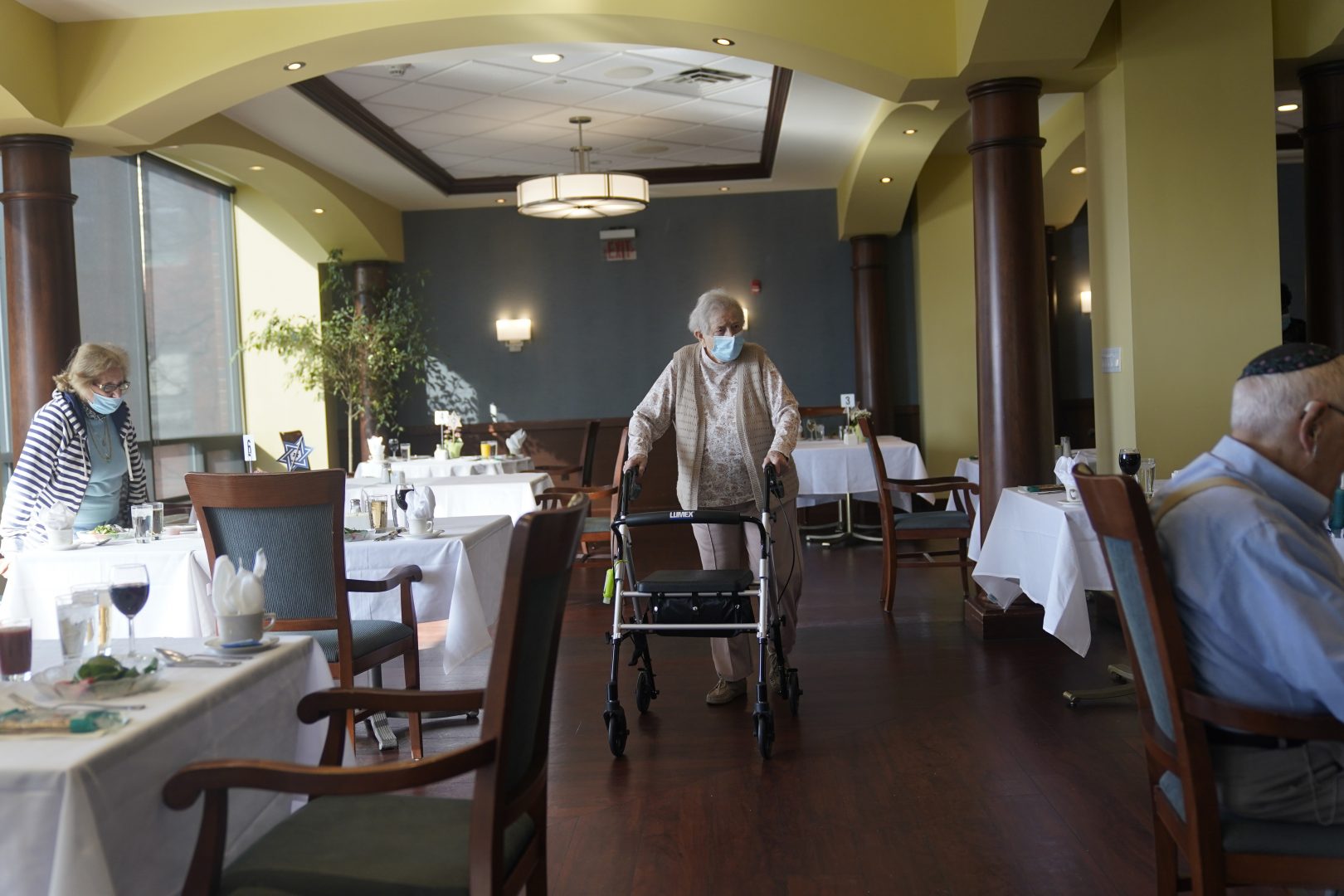 FILE PHOTO: In this April 1, 2021, file photo May Nast arrives for dinner at RiverWalk, an independent senior housing facility, in New York.