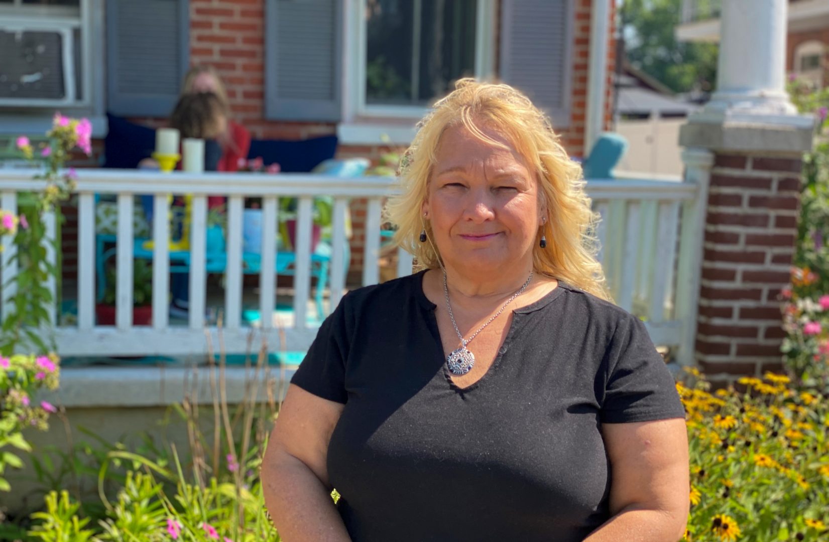 Mary Hogentogler stands in front of her house in Columbia Borough, Lancaster County, on Aug. 23, 2021. She had her house tested for lead paint after her daughter and grandson moved in. The house tested positive.