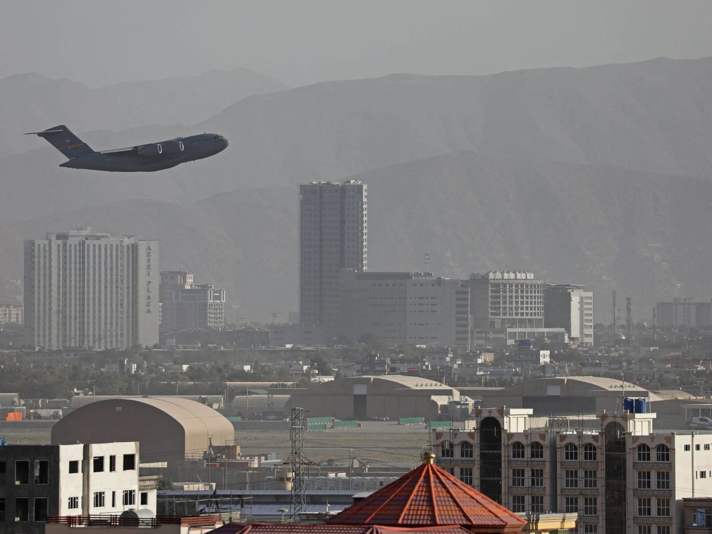 TOPSHOT - A US Air Force aircraft takes off from the military airport in Kabul on August 27, 2021, as the Pentagon said the evacuation of tens of thousands of people from Afghanistan still faces more possible attacks like the bombing that killed scores of people outside the Kabul airport. 