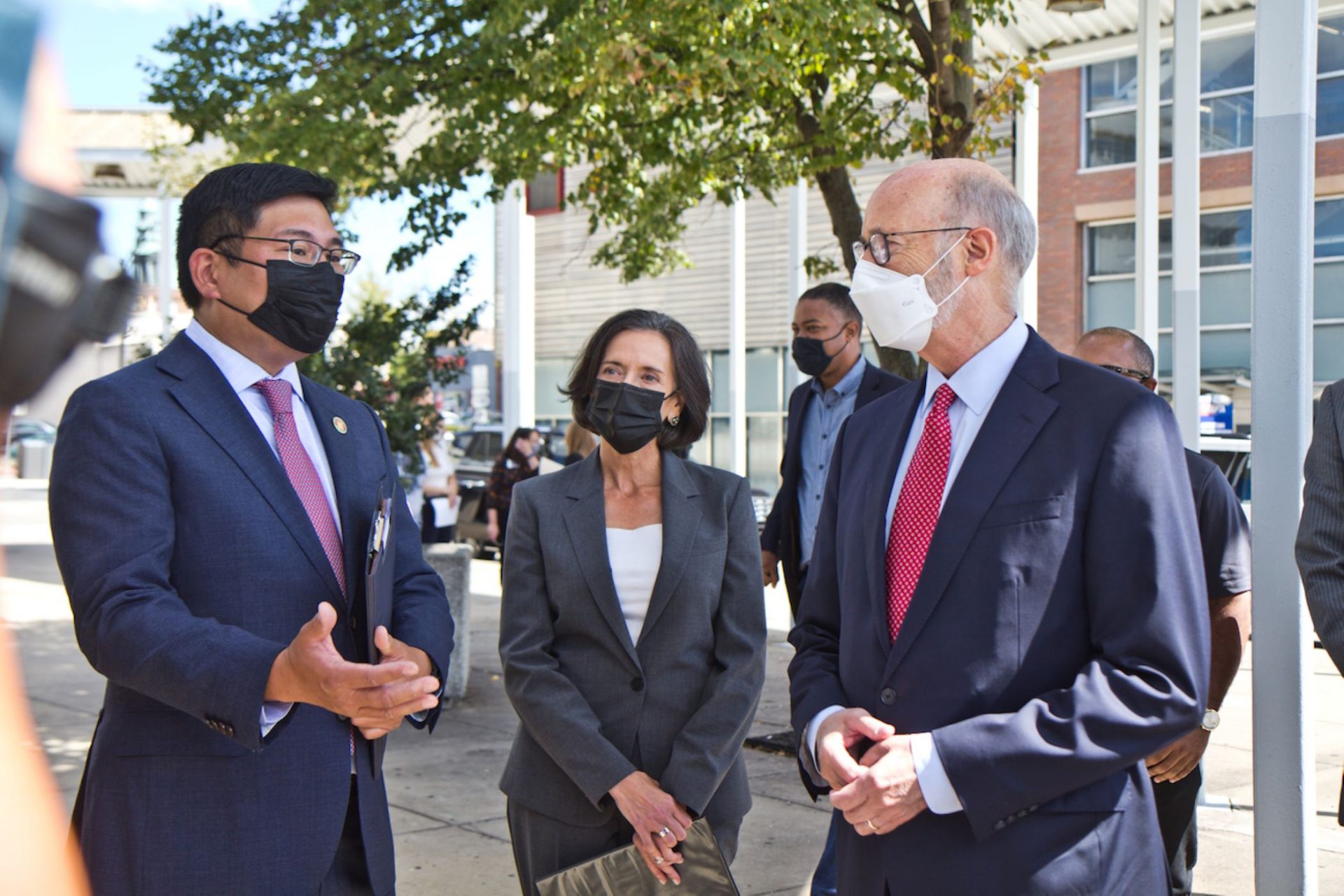 Pennsylvania Governor Tom Wolf (right) talked to Dr. Valarie Arkoosh and Dr. Alvin Wang at Norristown Transportation Center on September 29, 2021.