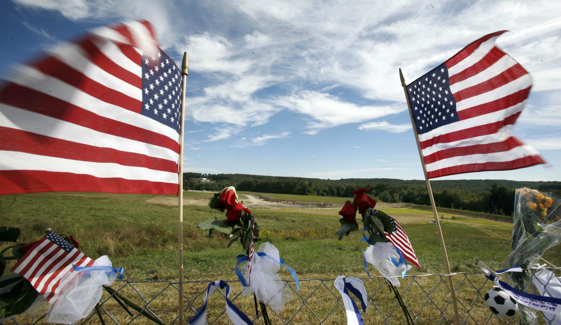 FILE PHOTO: Flags frame the crash site of United Flight 93 at the temporary Flight 93 memorial in Shanksville, Pa., Saturday, Sept. 11, 2010.