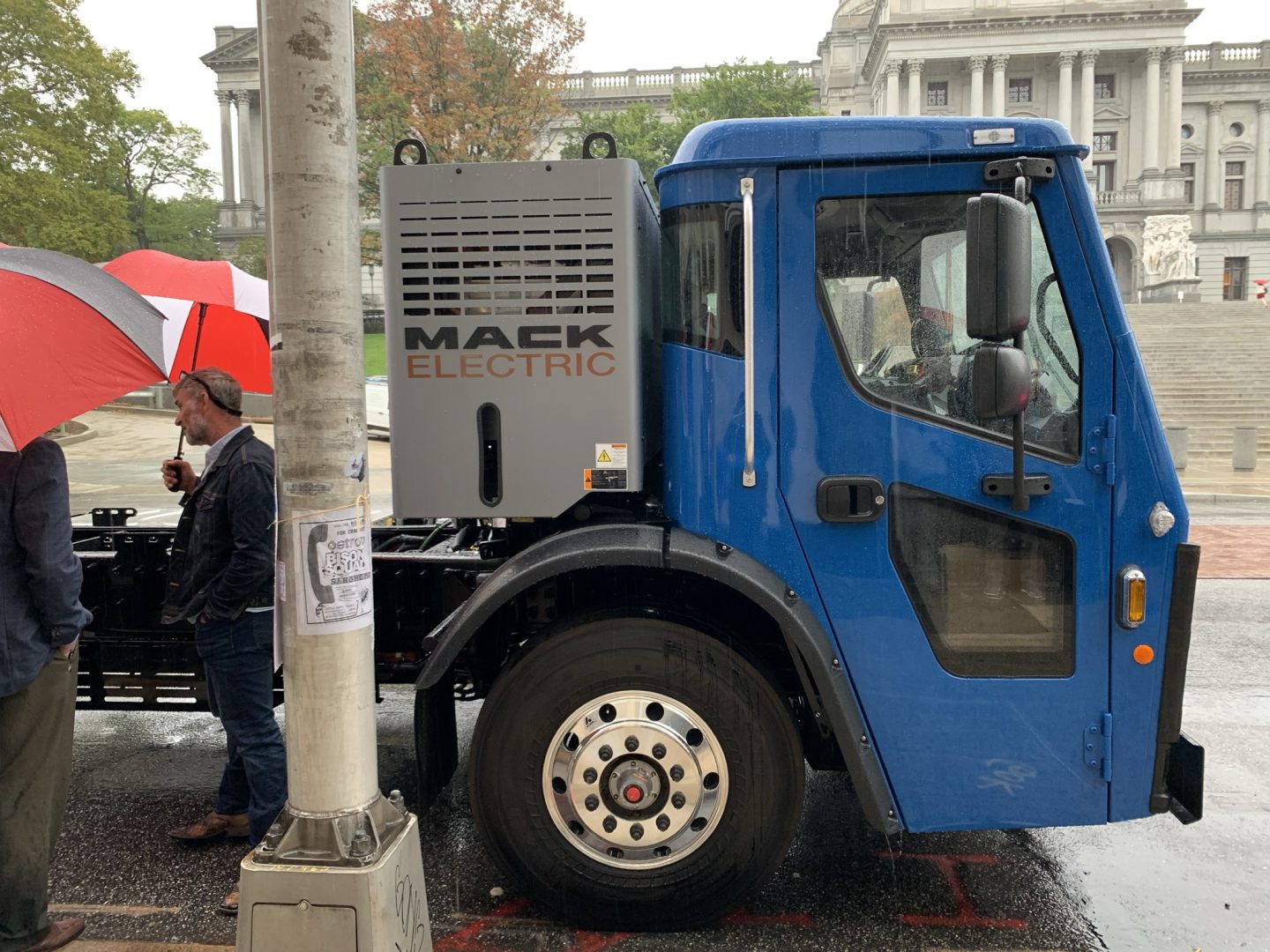A Mack LR Electric refuse truck is parked outside the state capitol on Sept. 28, 2021.