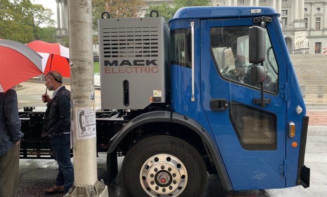 A Mack LR Electric refuse truck is parked outside the state capitol on Sept. 28, 2021.