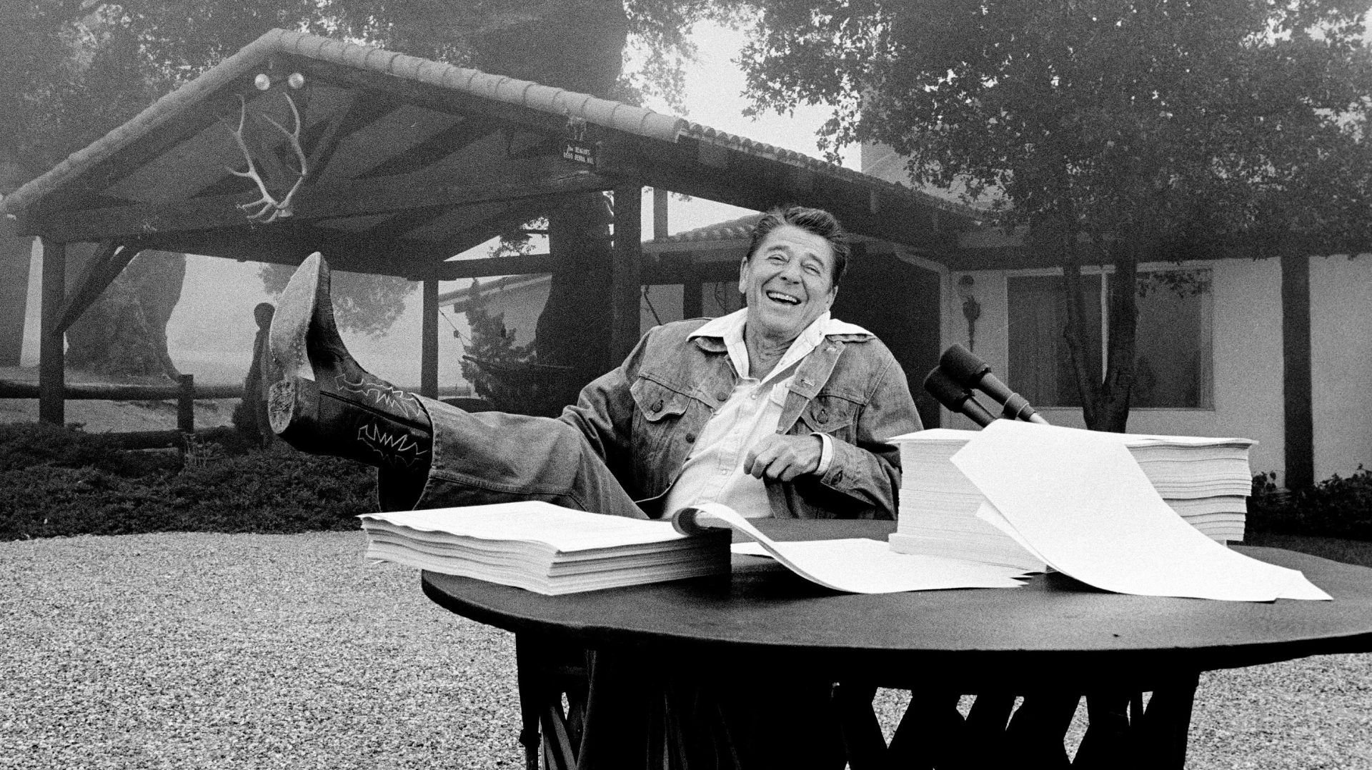 President Ronald Reagan shows his boot following the signing of his tax bill in August 1981 at his vacation home near Santa Barbara, Calif.