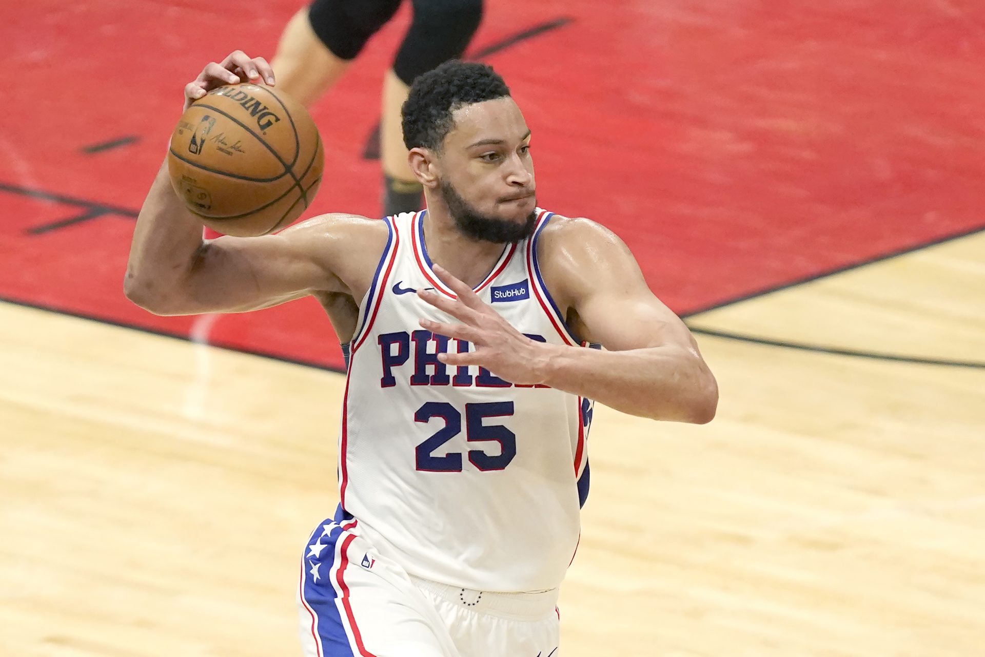 A fan shops for souvenirs before a preseason NBA basketball game between  the Philadelphia 76ers and the Toronto Raptors, Thursday, Oct. 7, 2021, in  Philadelphia. Ben Simmons was out of sight, out