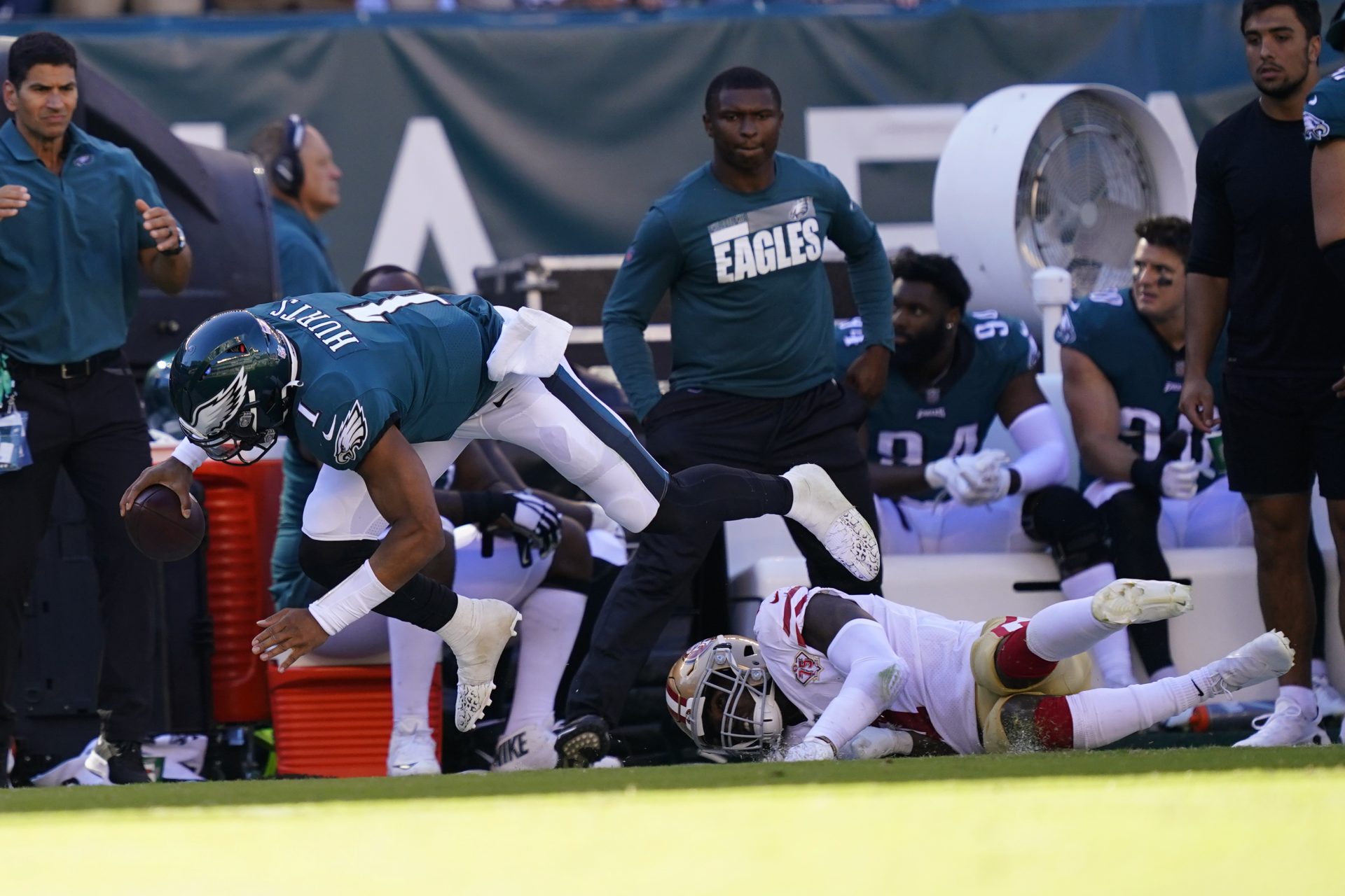 Philadelphia Eagles quarterback Jalen Hurts (1) falls with the ball during the second half of an NFL football game against the San Francisco 49ers on Sunday, Sept. 19, 2021, in Philadelphia.