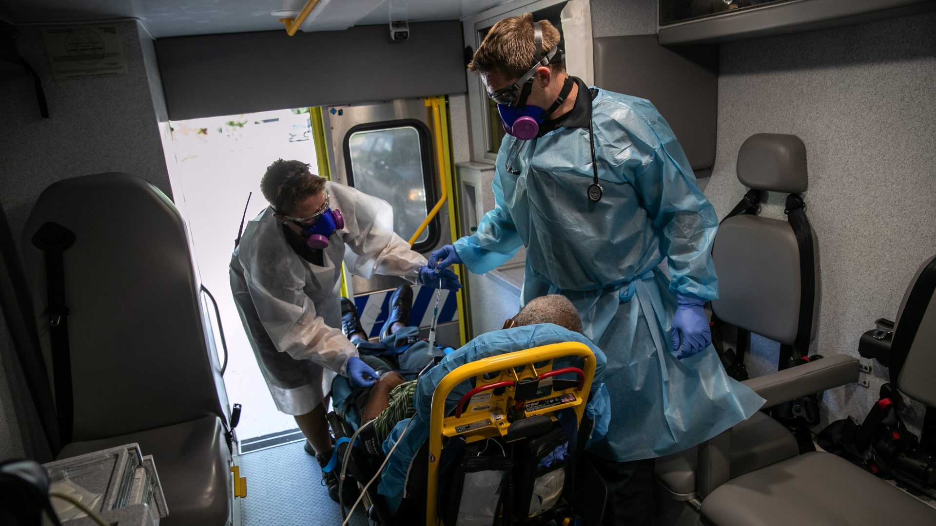 Medics transport a man with COVID-19 symptoms to a hospital in Austin, Texas. More than 3 million people in the state have had COVID-19, but just 81,000 are listed in a central data set at the Centers for Disease Control and Prevention.