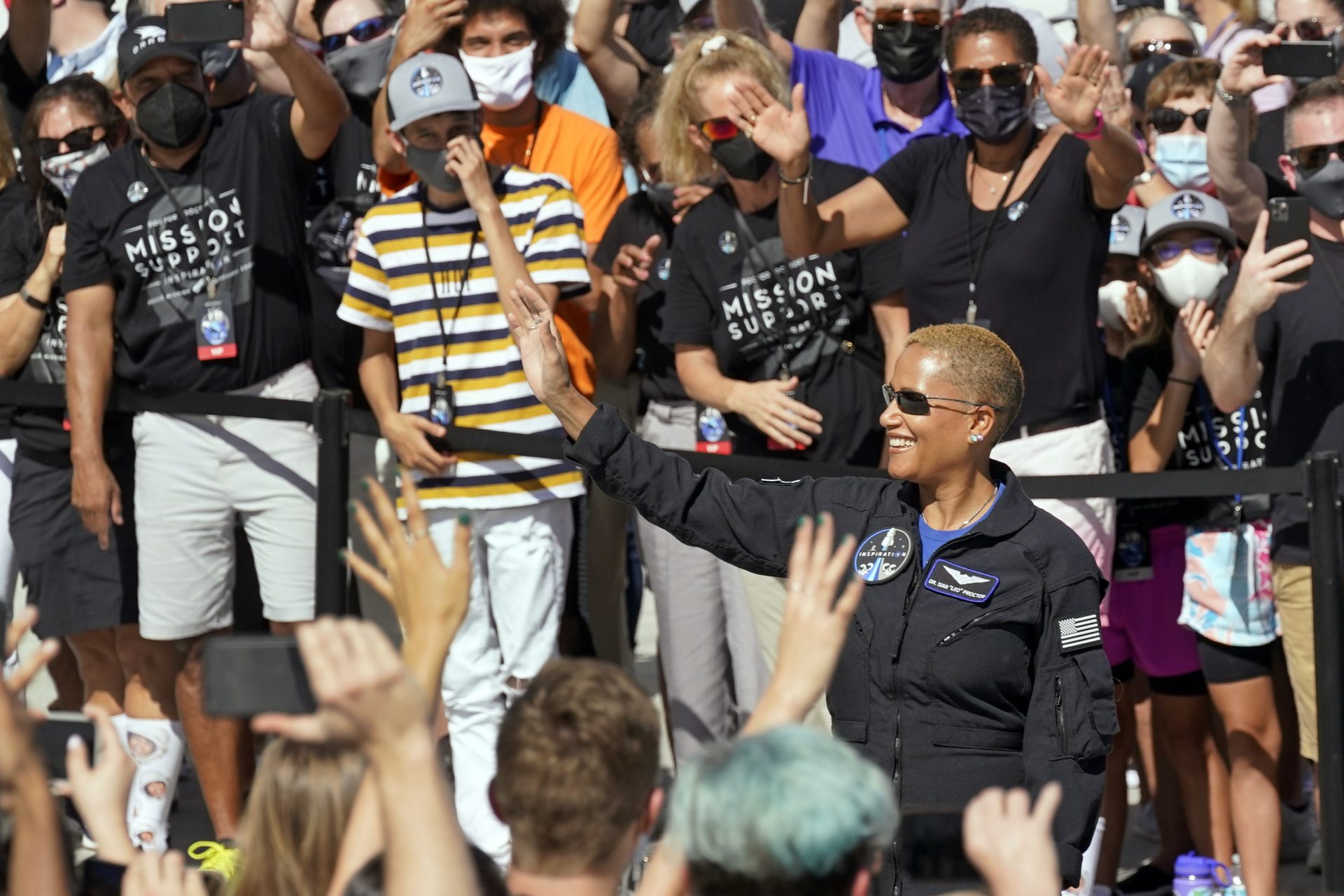 Sian Proctor waves as she prepares to head to pad 39A for a launch on a SpaceX Falcon 9 rocket at the Kennedy Space Center in Cape Canaveral, Fla., Wednesday Sept. 15, 2021.