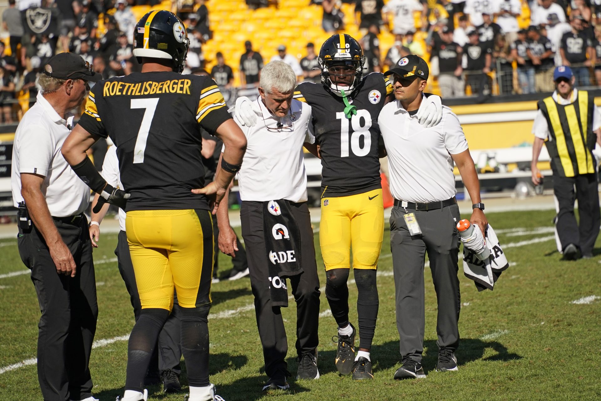 Pittsburgh Steelers quarterback Ben Roethlisberger (7) watches as wide receiver Diontae Johnson (18) is helped off the field after being injured during the second half of an NFL football game against the Las Vegas Raiders in Pittsburgh, Sunday, Sept. 19, 2021.