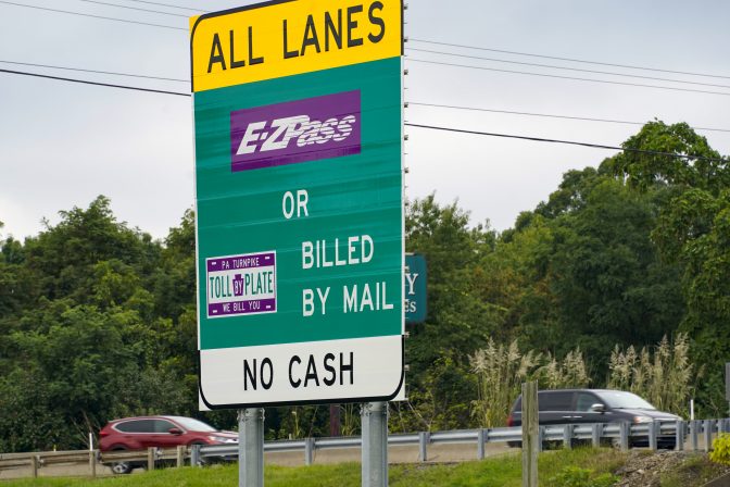 Signs on the entrance ramp in Gibsonia, Pa., indicate to motorists the methods being used to collect tolls on the Pennsylvania Turnpike on Monday, Aug. 30, 2021.