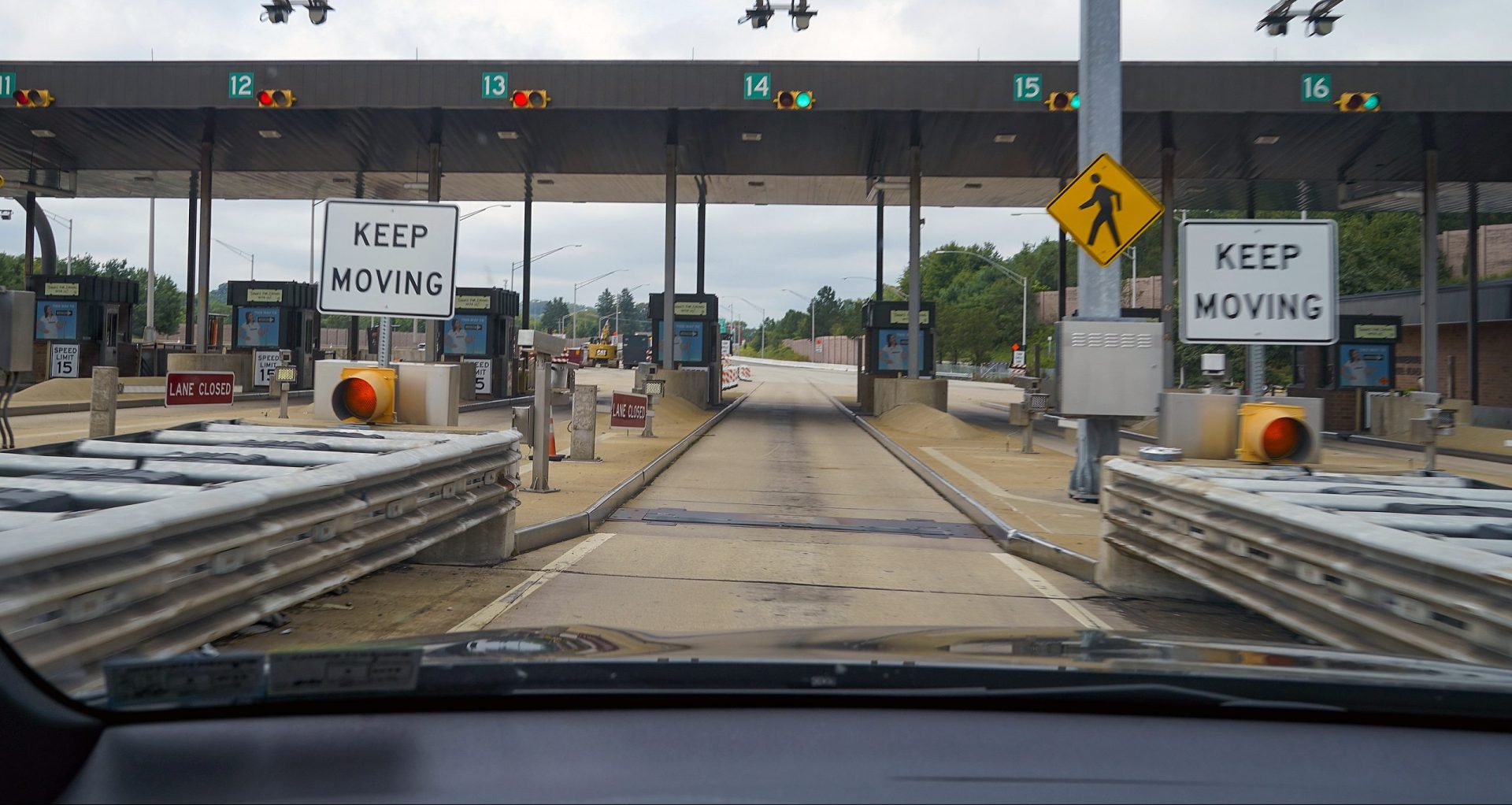 In this photo made through a windshield, the sensors and lights are seen at the west bound toll gate of the Pennsylvania Turnpike in Cranberry Township, Pa., on Monday, Aug. 30, 2021.