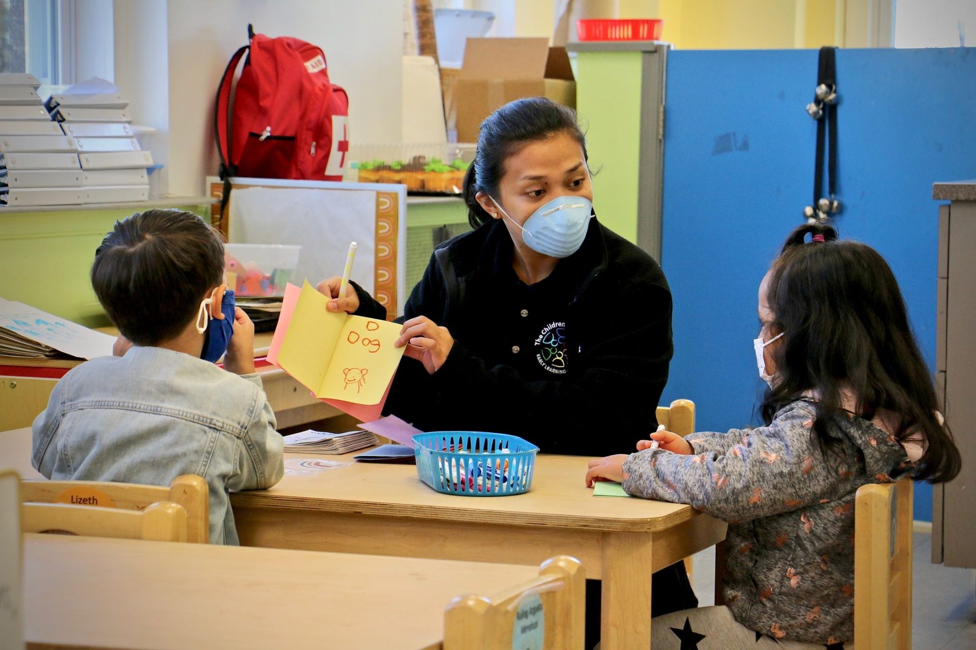 Ghealze Bernstein works with preschool students at Children's Playhouse Whitman in South Philadelphia.