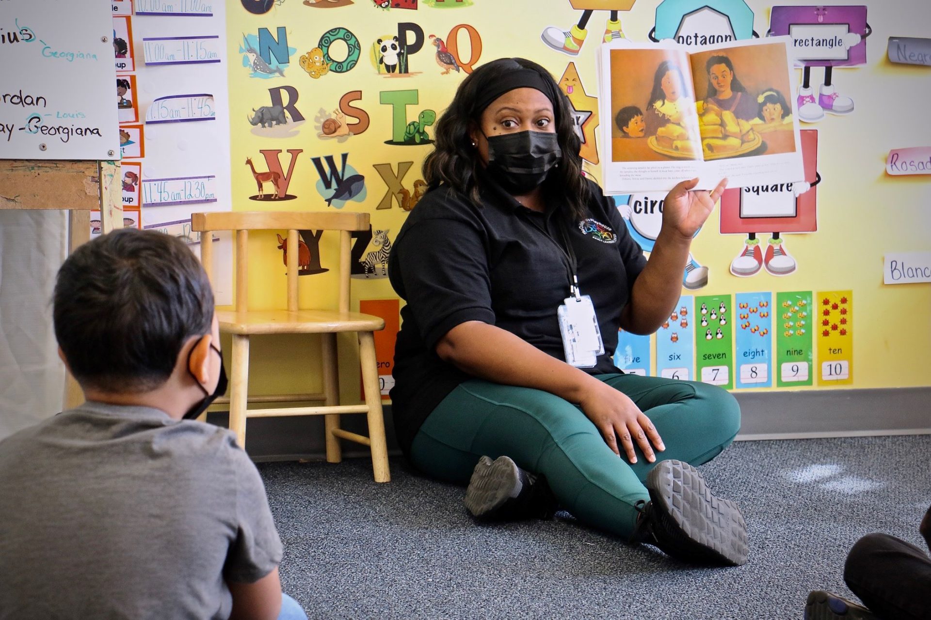 Kendra Jackson reads to her class of preschoolers at Children’s Playhouse Whitman, an early childhood learning center in South Philadelphia.