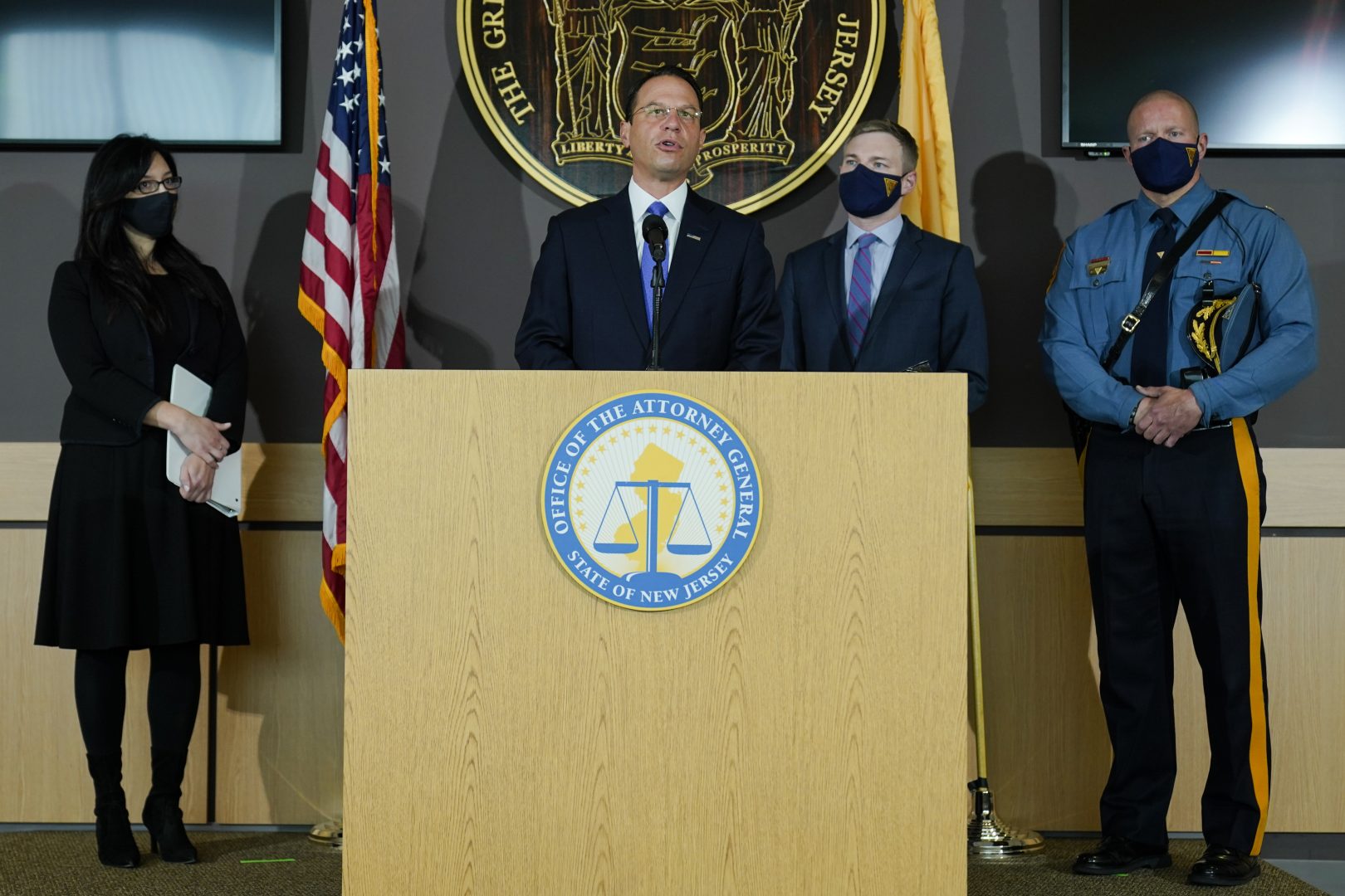 Pennsylvania Attorney General Josh Shapiro, center, speaks, as from left, Lyndsay Ruotolo, Director, New Jersey Division of Criminal Justice, New Jersey acting Attorney General Andrew Bruck, and New Jersey State Police Maj. Frederick Fife listen during a news conference regarding ghost guns, Friday, Oct. 29, 2021,  in Ewing, N.J. (AP Photo/Matt Rourke)