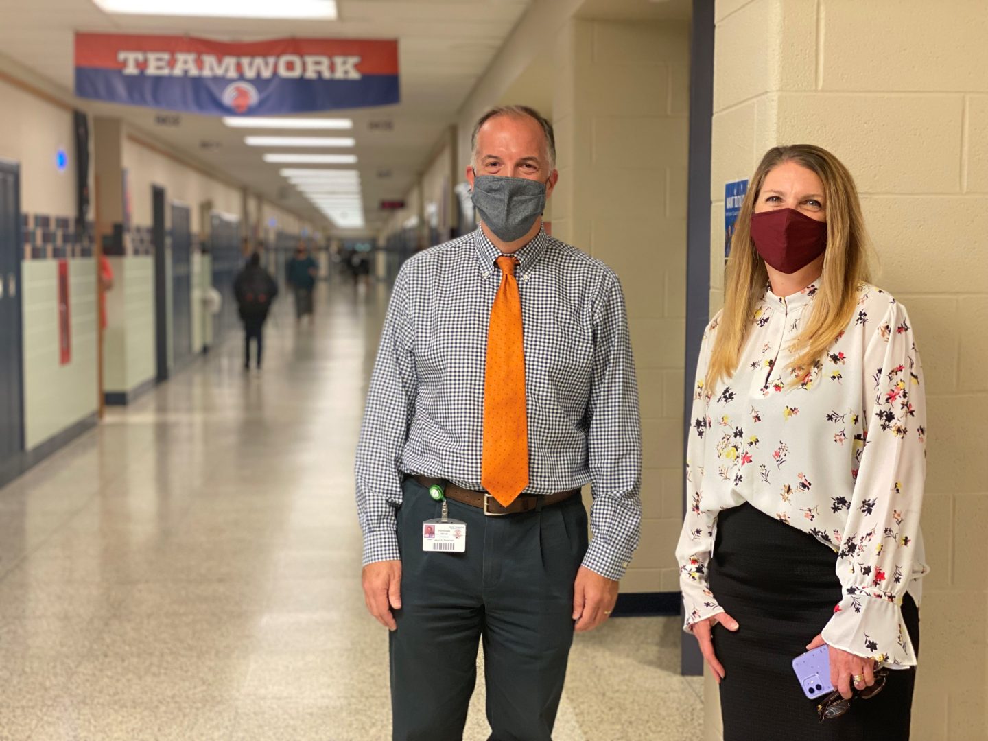 Derry Township School District psychologist Jason Pedersen, left, and Superintendent Stacy Winslow, right, stand in the hallway at Hershey Middle School. 