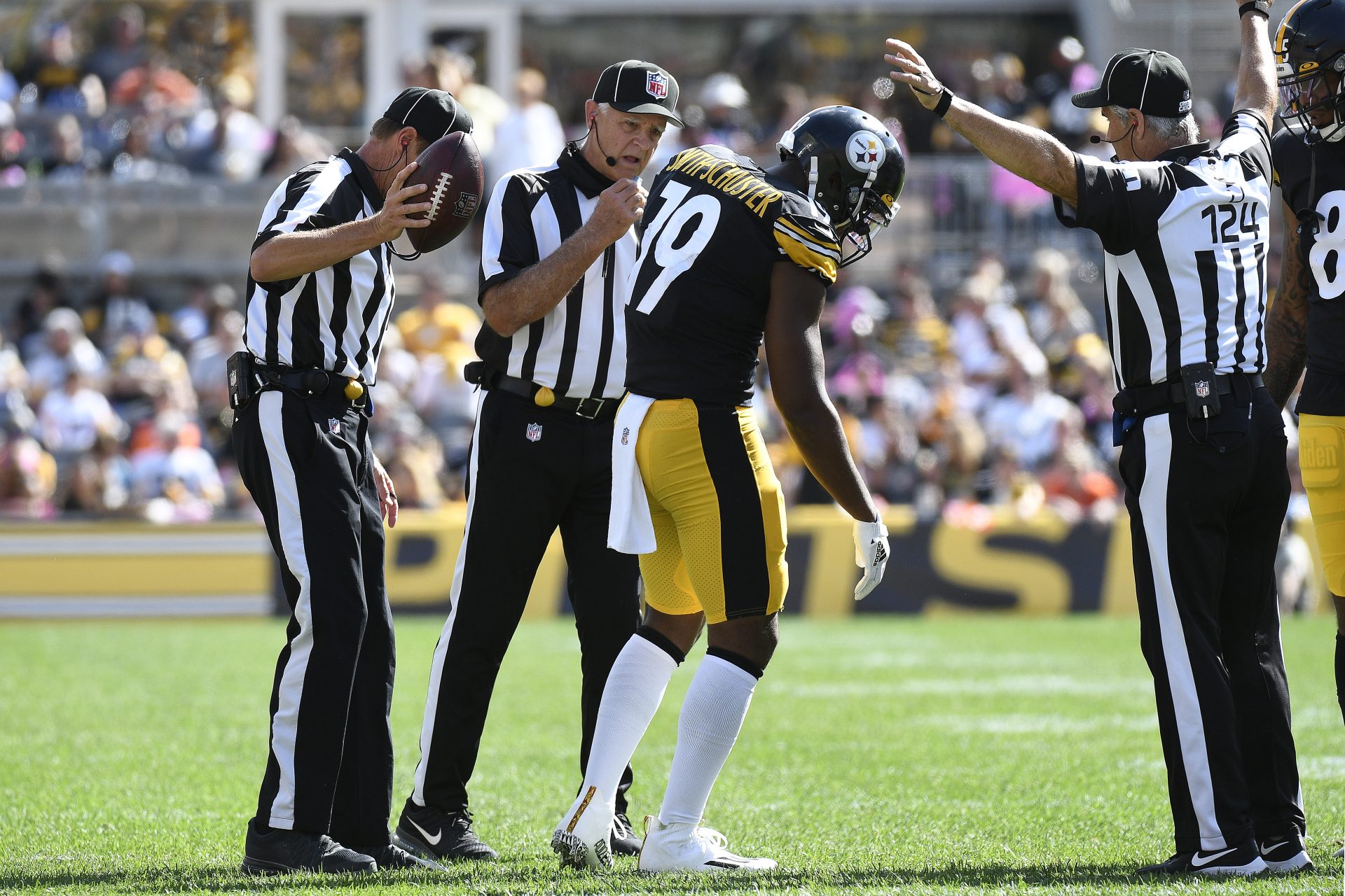 Pittsburgh Steelers wide receiver JuJu Smith-Schuster (19) gets up after being injured on a play during the first half of an NFL football game against the Denver Broncos in Pittsburgh, Sunday, Oct. 10, 2021.