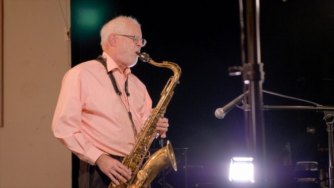 Tom Strohman playing saxaphone.