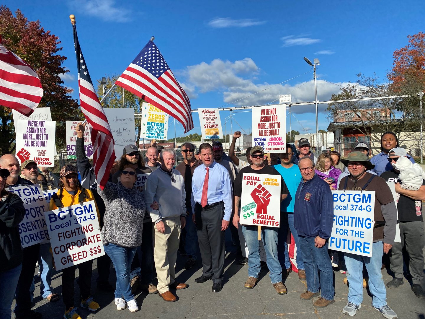 U.S. Labor Secretary Marty Walsh stands with union workers outside of the Kellogg Company plant in Lancaster County. 