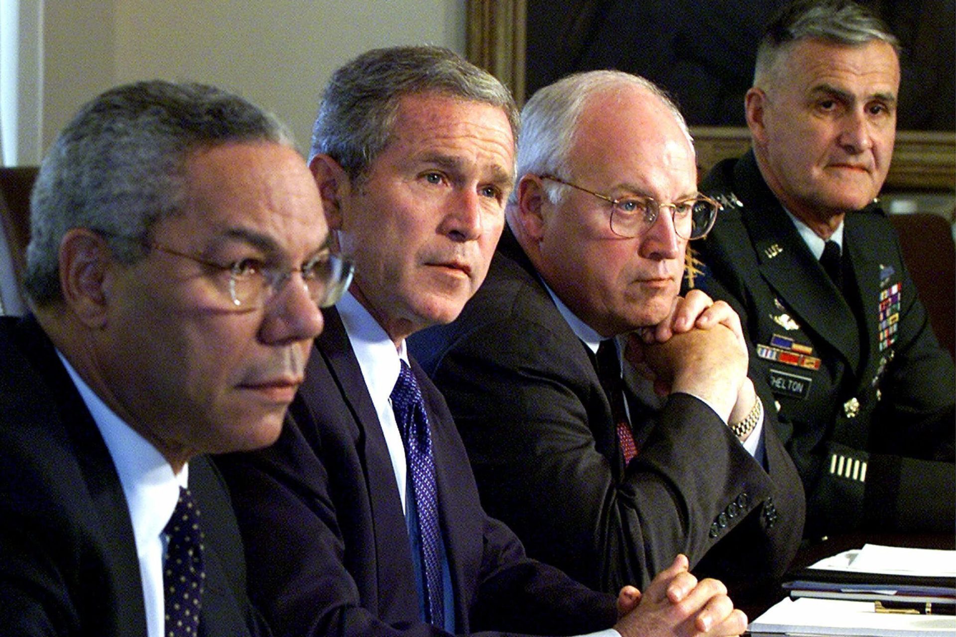 In this Wednesday, Sept. 12, 2001 file photo, from left, Secretary of State Colin Powell, President George W. Bush, Vice President Dick Cheney and Chairman of the Joint Chiefs of Staff Gen. Henry Shelton attend a meeting with the National Security Council in the Cabinet Room of the White House.